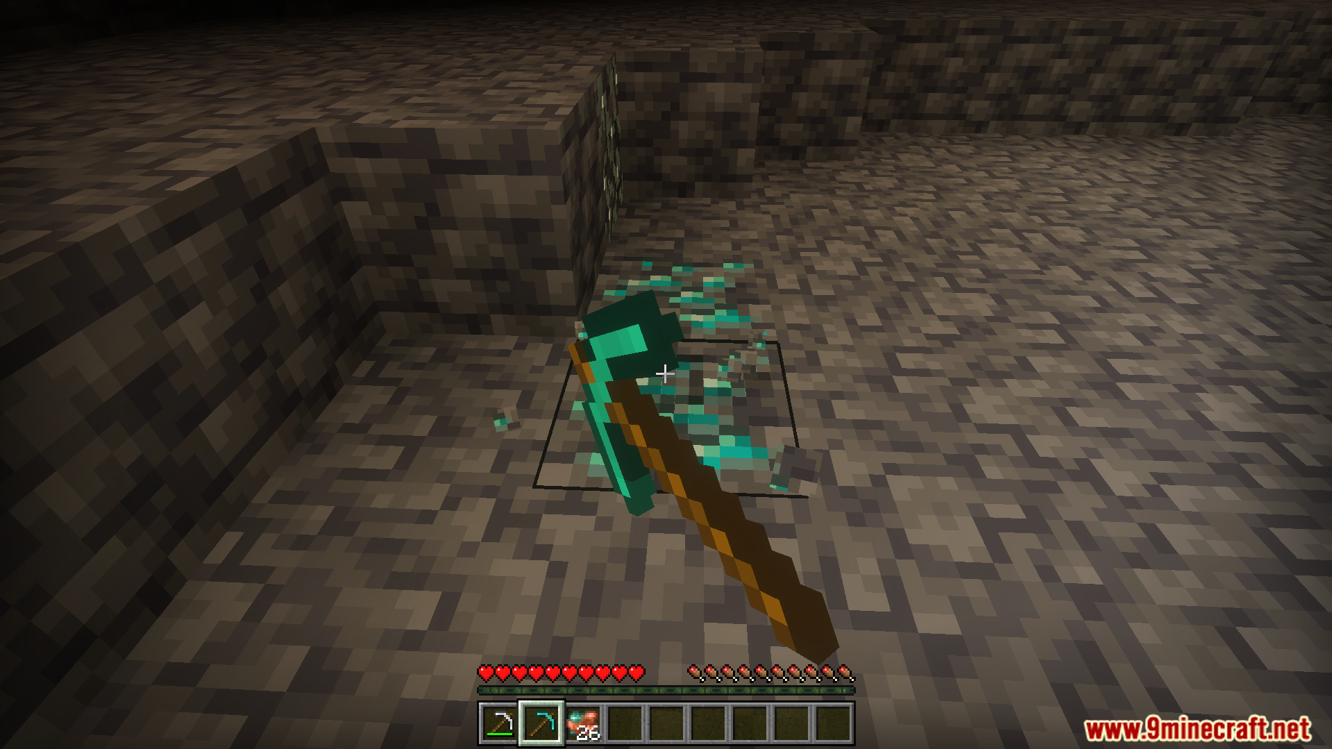 A player uses a diamond pickaxe to mine a vein of valuable ore