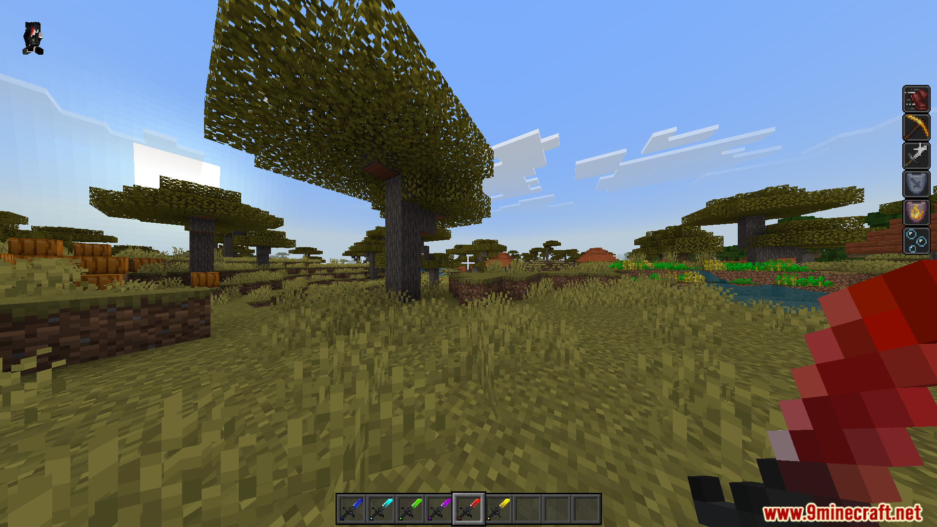 NasaRemixs Elemental Swords Addon Screenshot 8 Player holding a red elemental sword while standing in a savanna biome