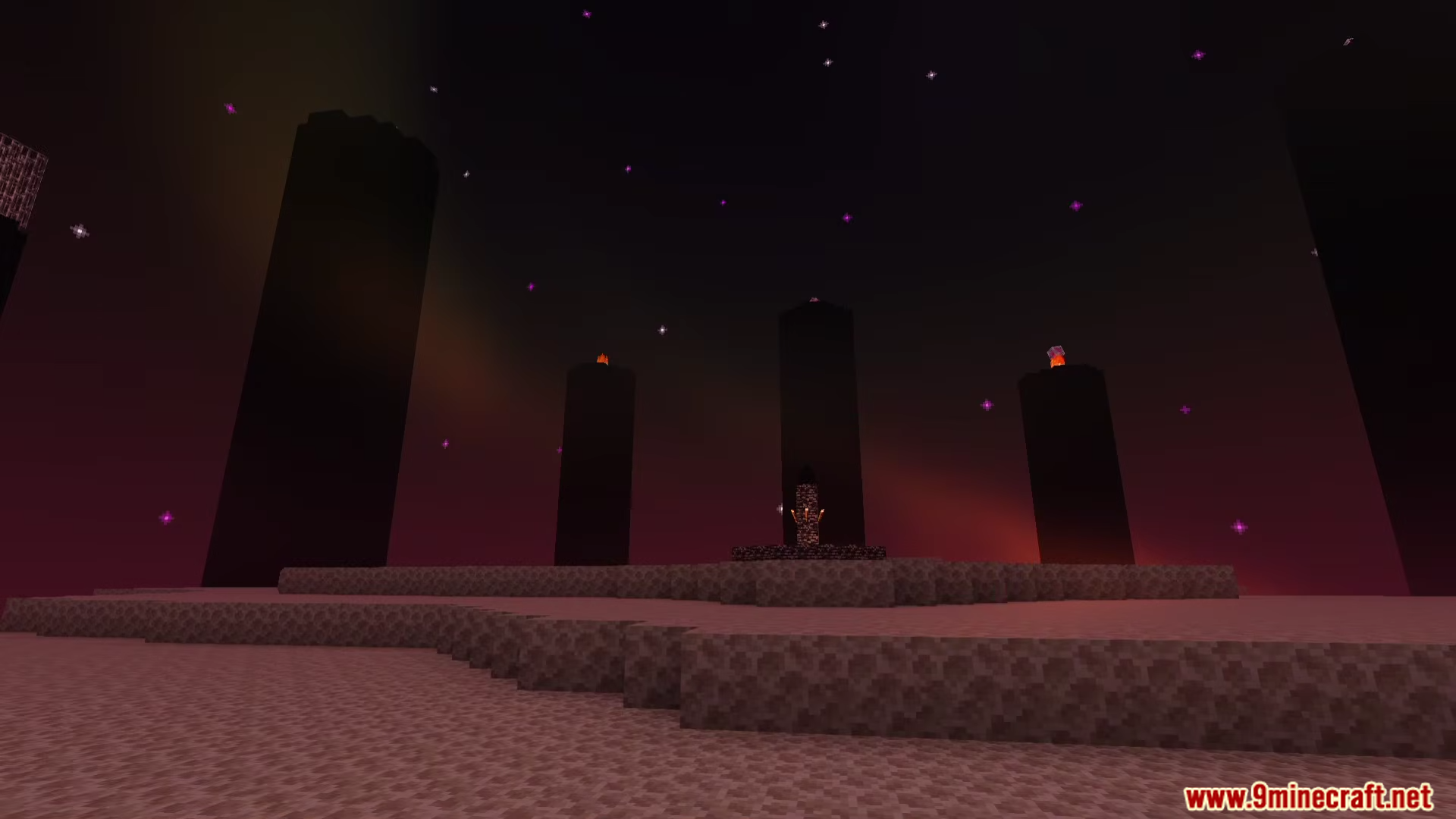 Obsidian pillars and end stone terrain under a dark purple sky