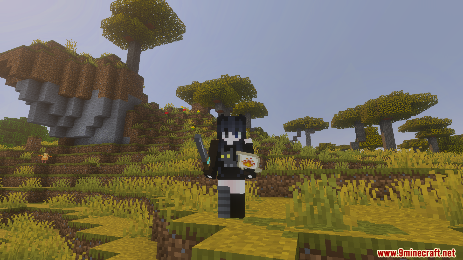 Nicos Magic Spells Addon Screenshot 2 Minecraft player standing in a savanna biome holding a wand and fire scroll