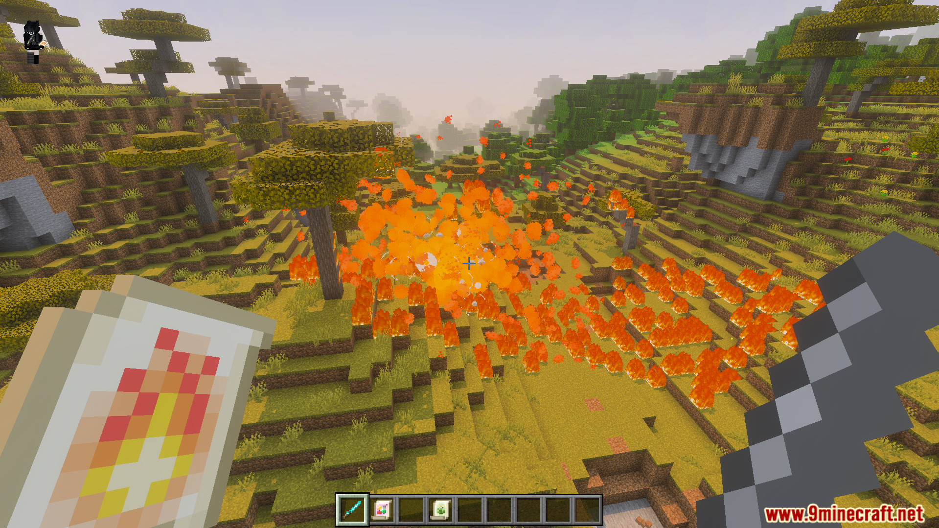 Nicos Magic Spells Addon Screenshot 8 Large fire explosion triggered by a magic scroll in a savanna biome