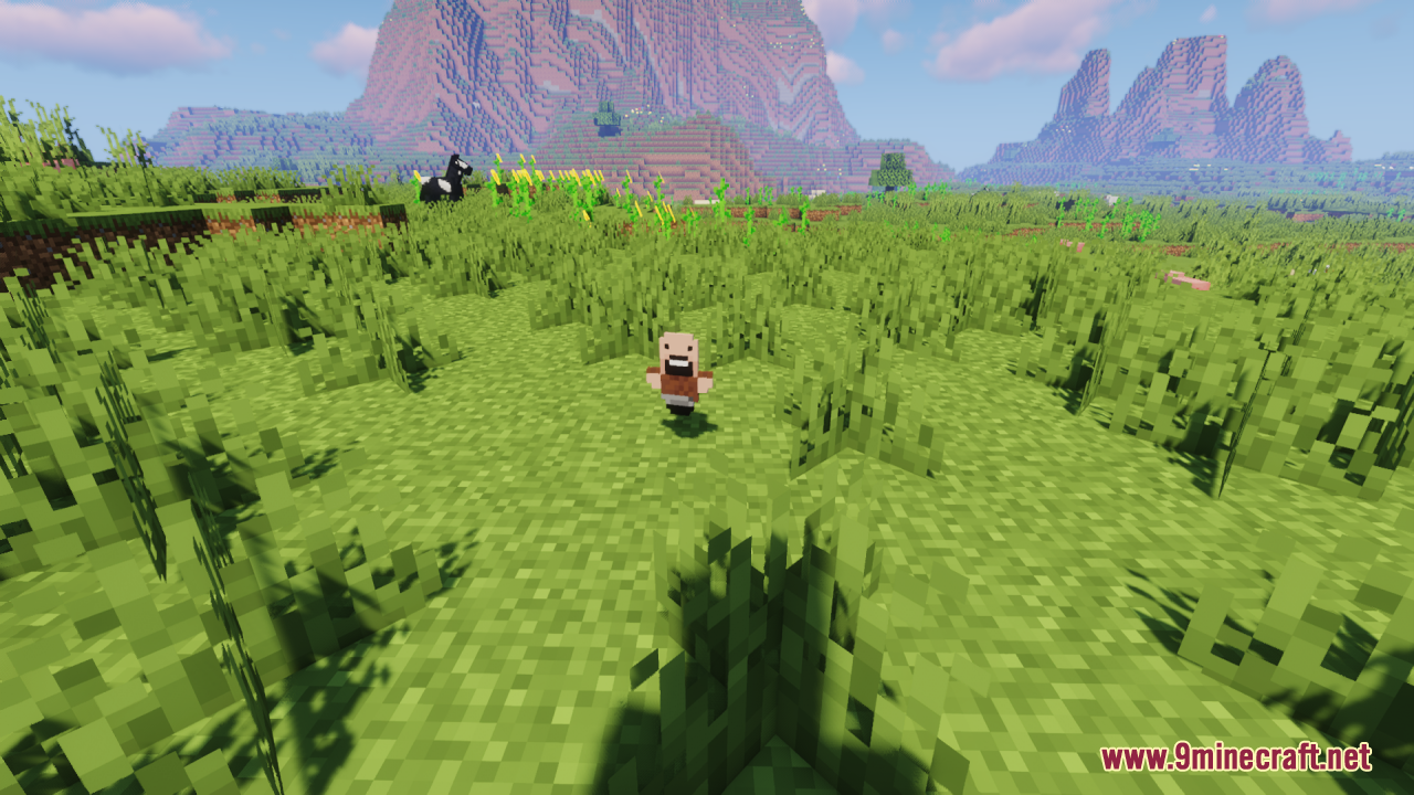 Notch Totem of Undying Resource Pack Screenshot 1 A small Notch totem item sits on the grass with mountains behind it