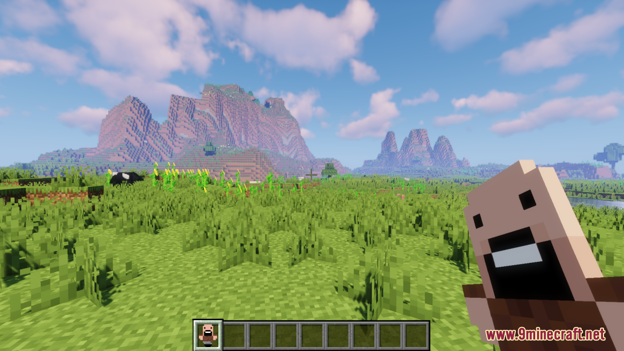 Notch Totem of Undying Resource Pack Screenshot 11 Player holding a Notch totem of undying in a scenic Minecraft landscape