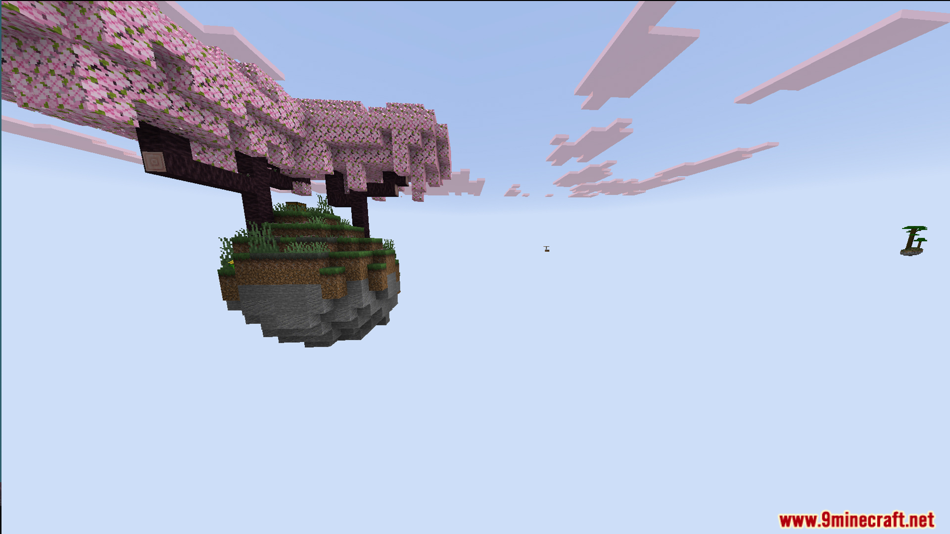 A floating island featuring a pink cherry blossom tree under a blue sky