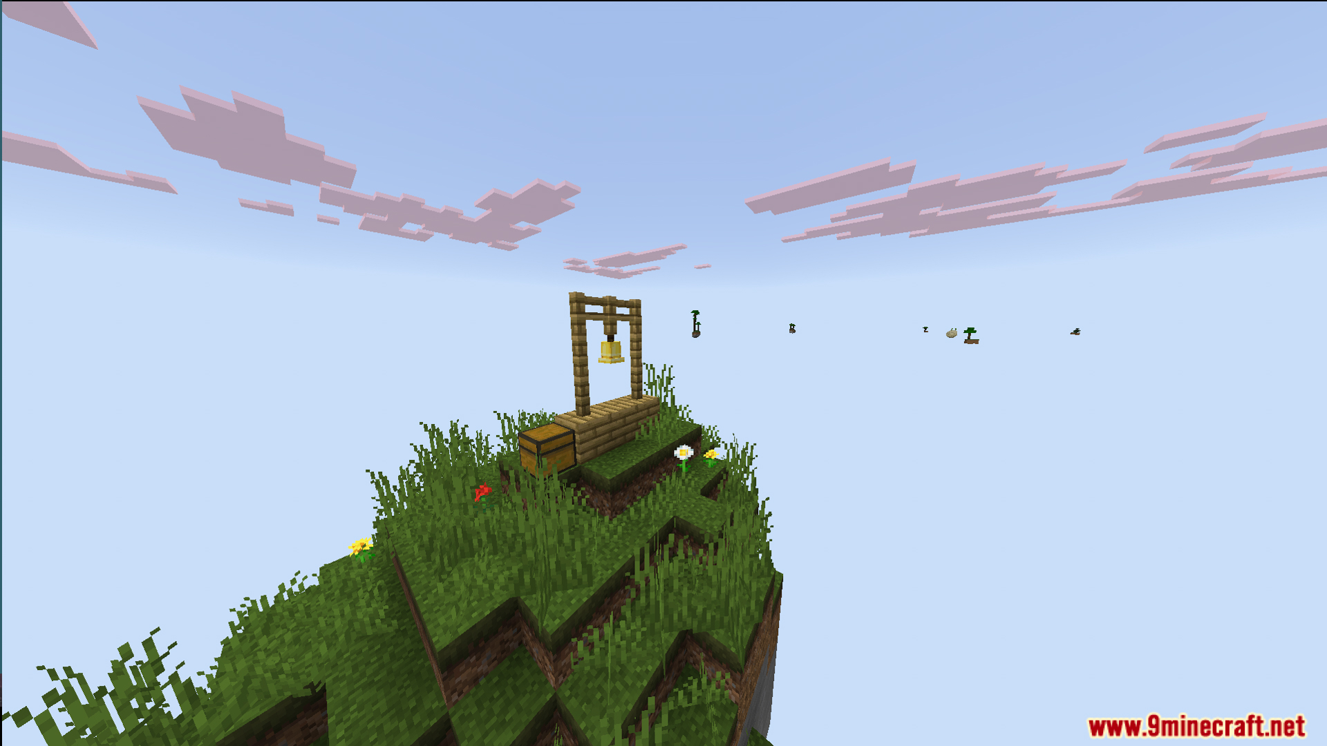 A small floating grass island with a bell and a wooden chest
