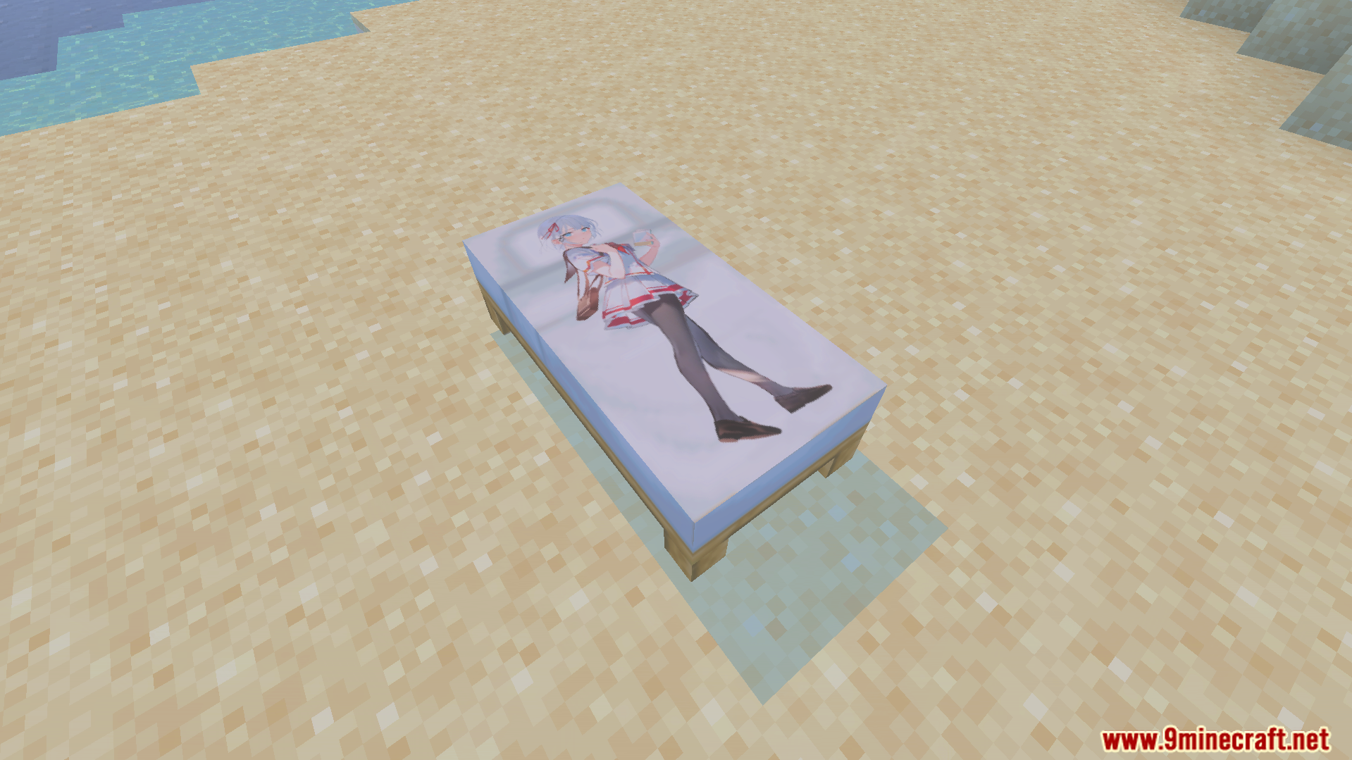 A white bed with an anime girl character texture placed on sand