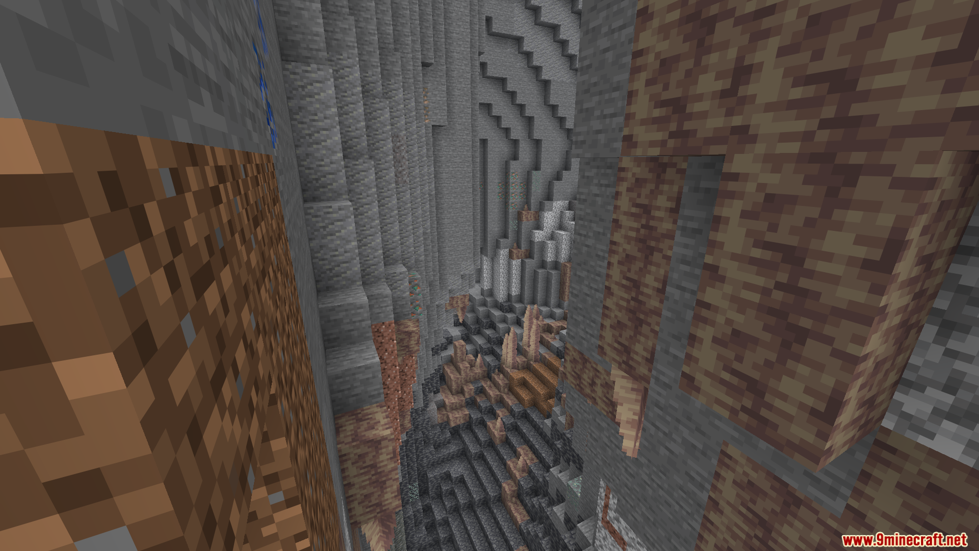 Optimized Fullbright Mod Screenshot 1 A deep underground ravine showing various rock layers and dripstone formations