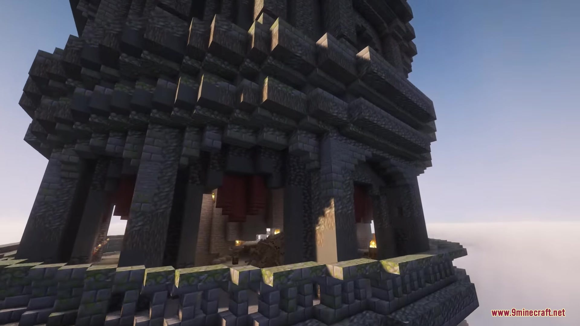 Orbital Railgun Reforged Mod Screenshot 7 Detailed view of a tall dark stone tower structure under a clear sky