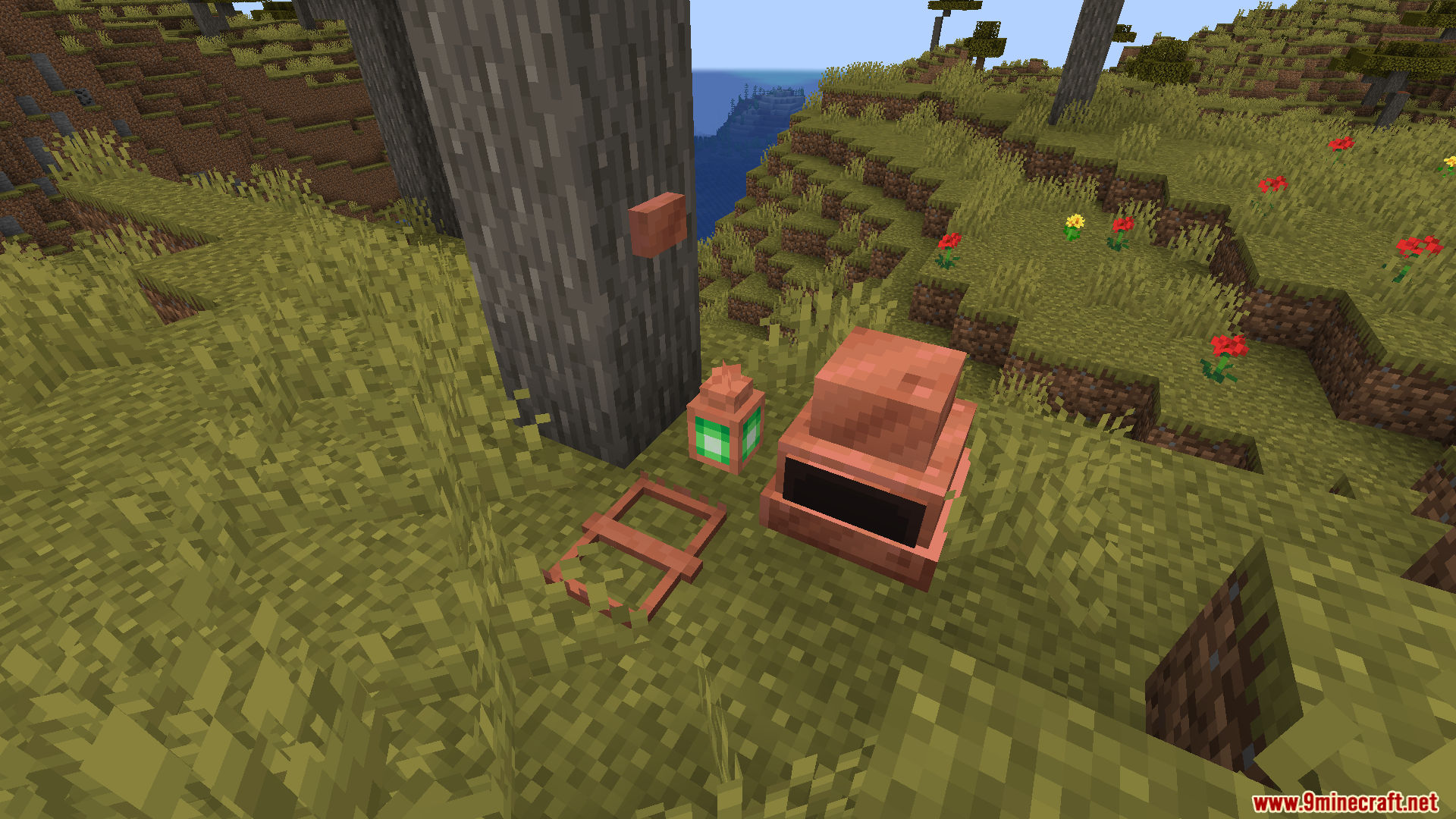 Copper button on a tree next to a green lantern and copper furnace