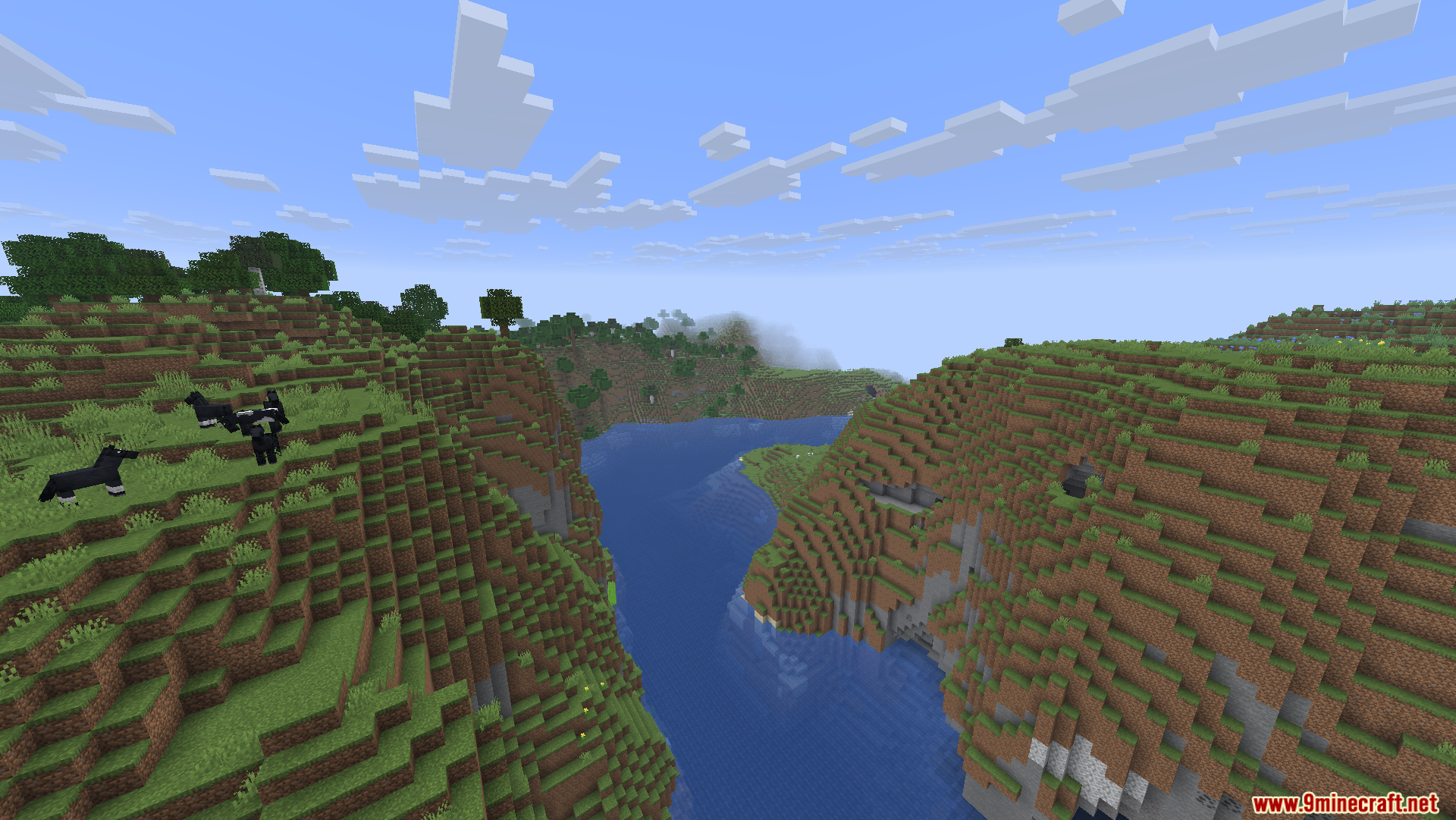Black horses grazing on a hillside overlooking a wide river in Minecraft