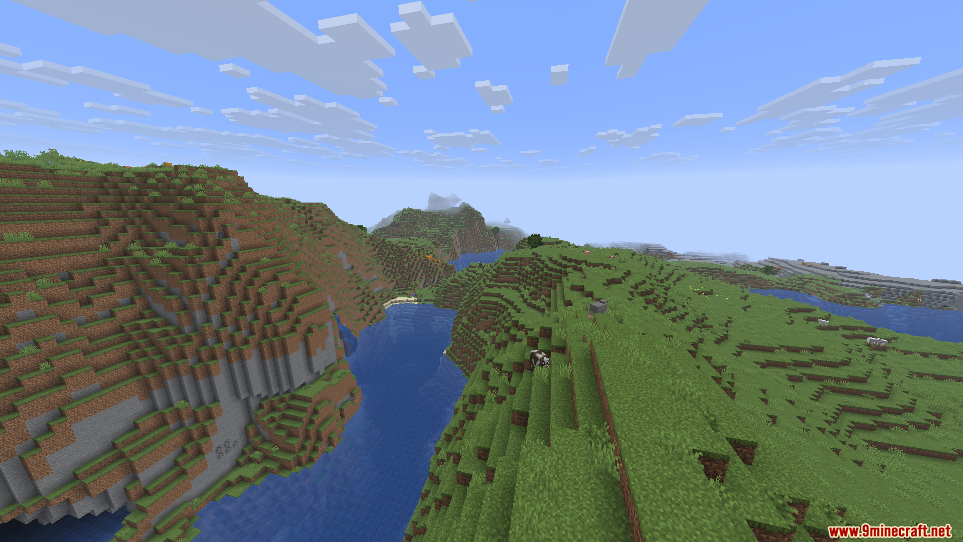 A scenic view of a river valley between grassy hills in Minecraft