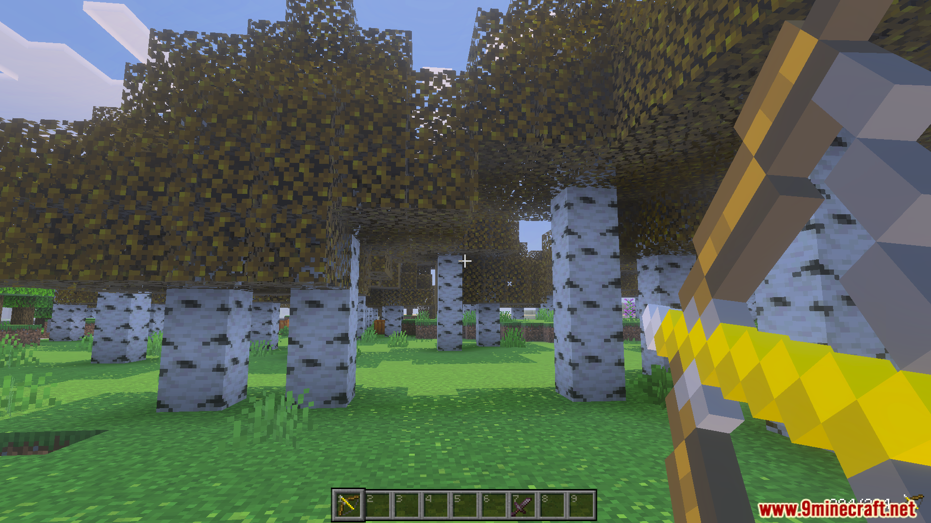 Player holding a golden bow with numbered hotbar slots in a birch forest