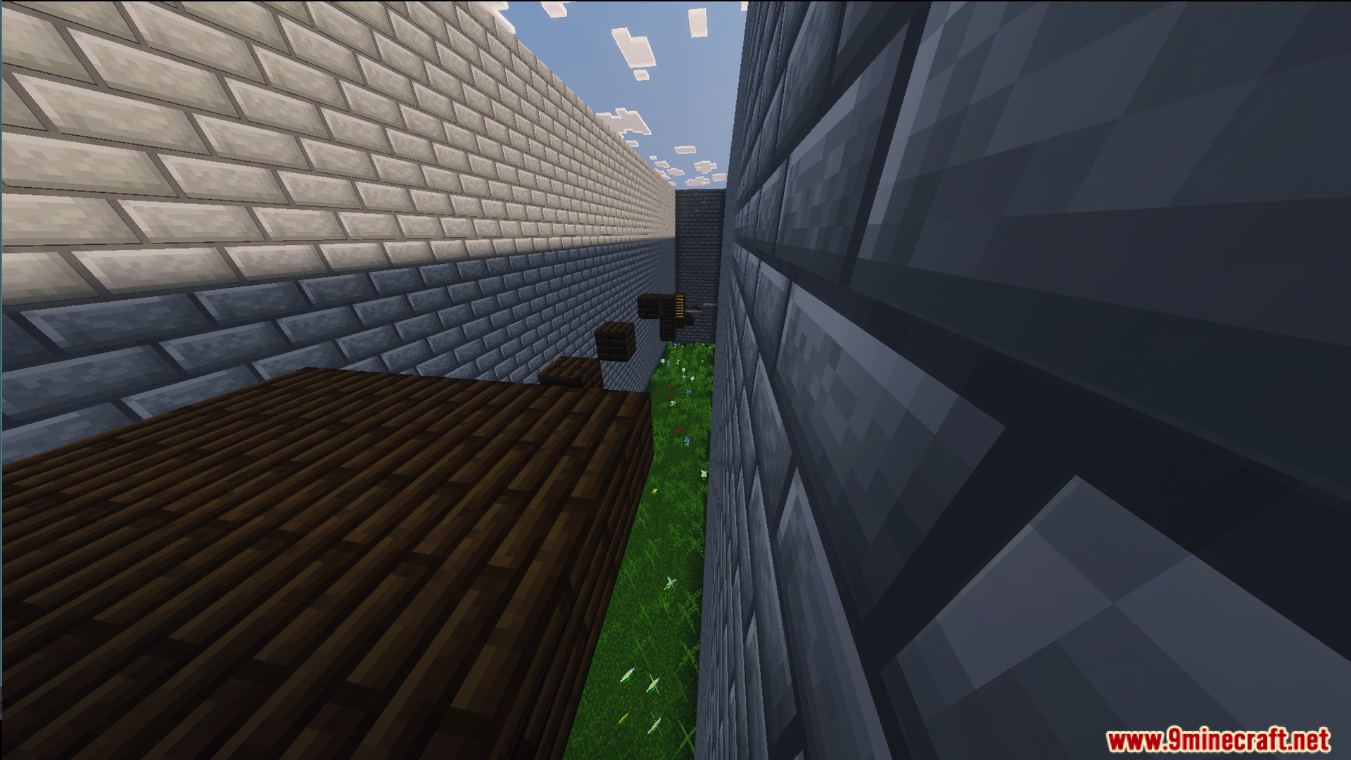 Easy parkour jumps inside a narrow stone brick corridor over a grassy floor