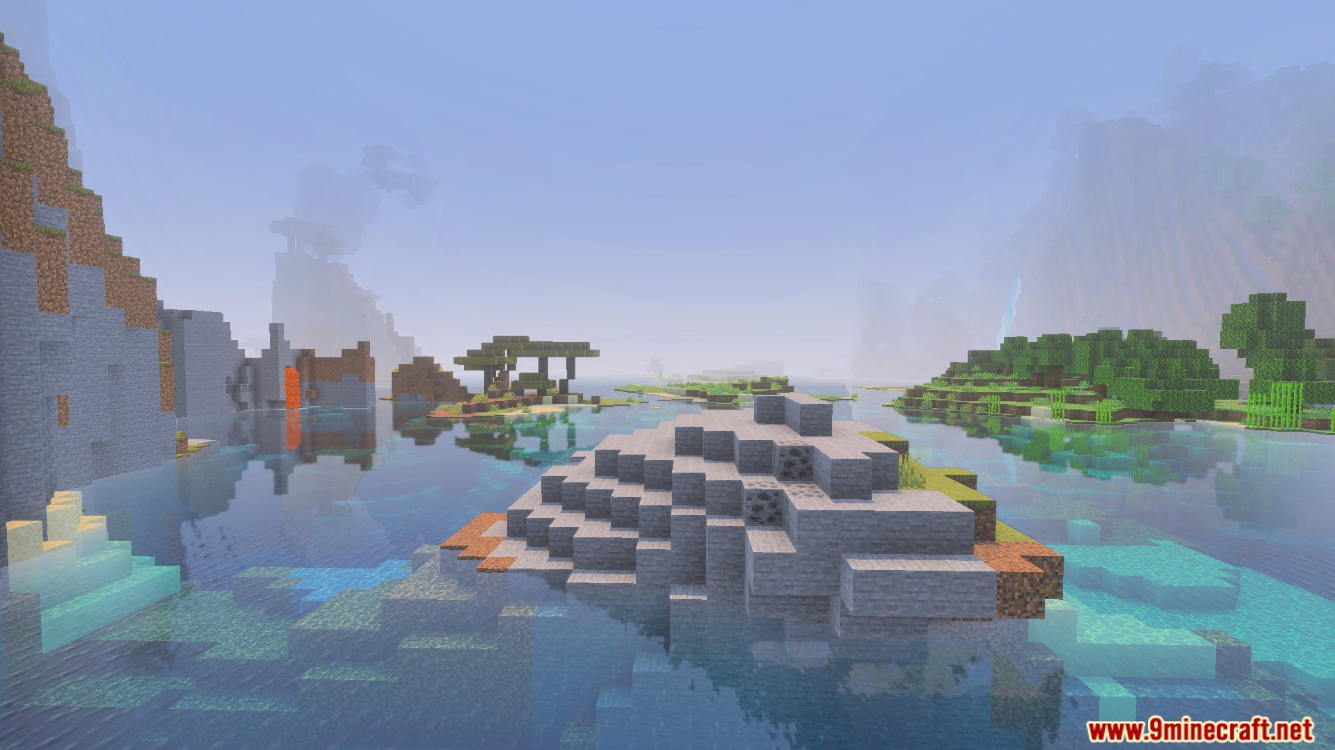 A rocky island sits in clear water with distant mountains and lava flows