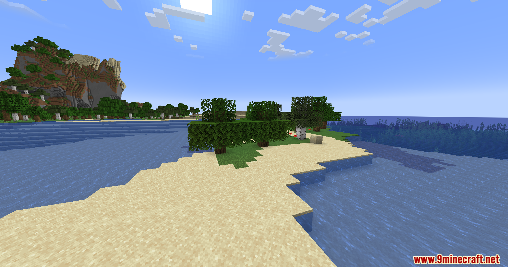 Sunlight shines over a sandy beach and green trees in a Minecraft world