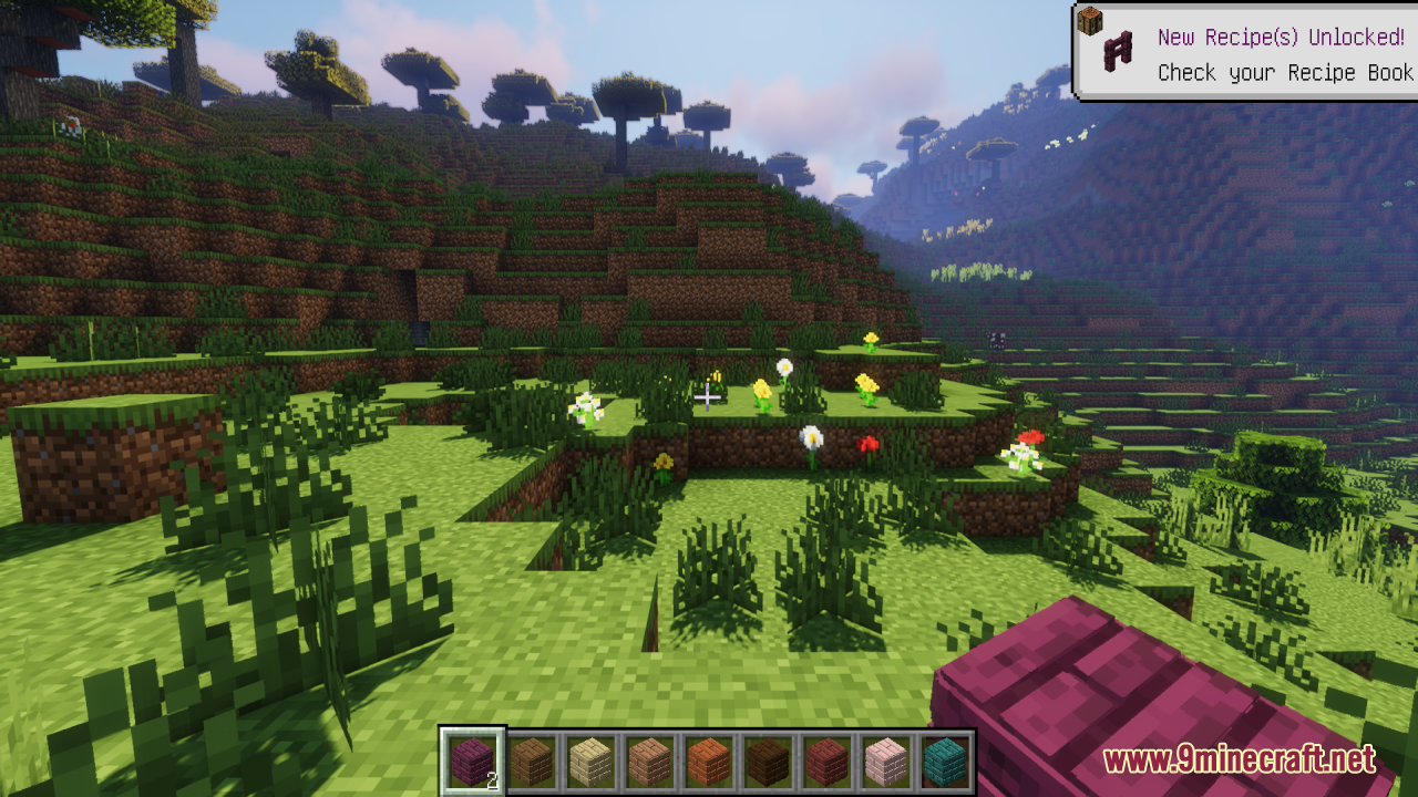Player holding a detailed 3D crimson plank block in a Minecraft world