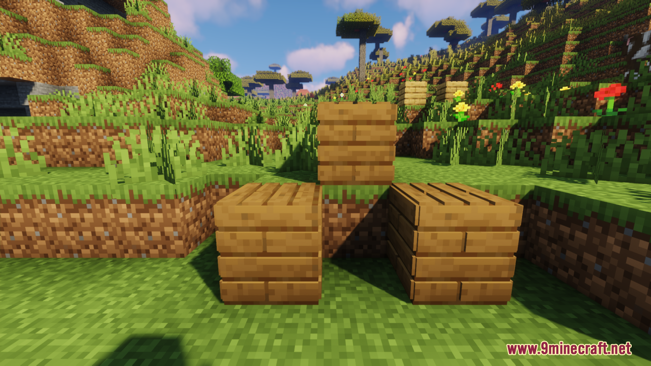 Three wooden blocks from the Planks 3D Resource Pack on grass