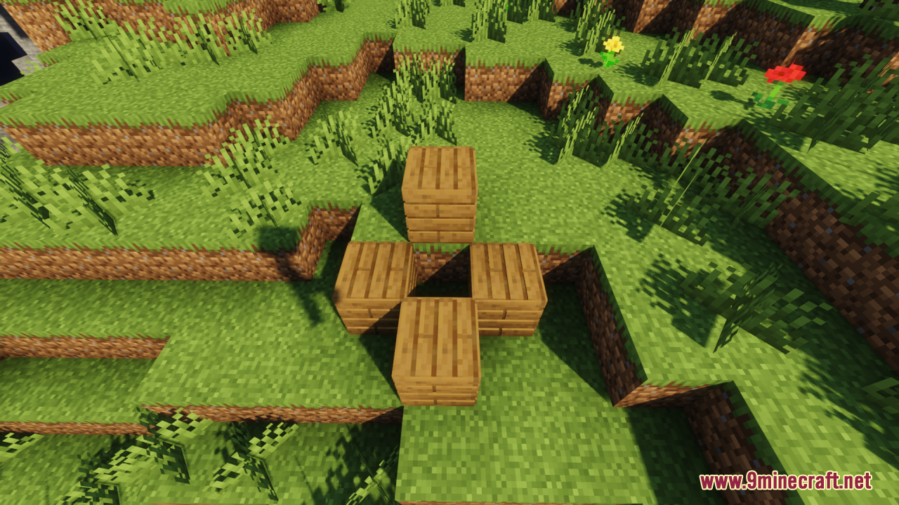 Four 3D wooden plank blocks arranged in a cross pattern on grass