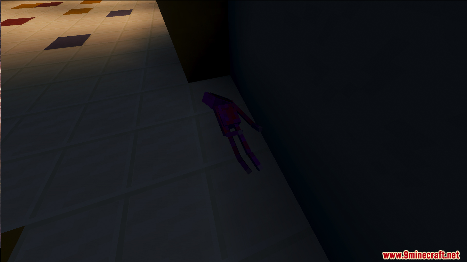 A small purple toy lies on the floor of a dark factory room