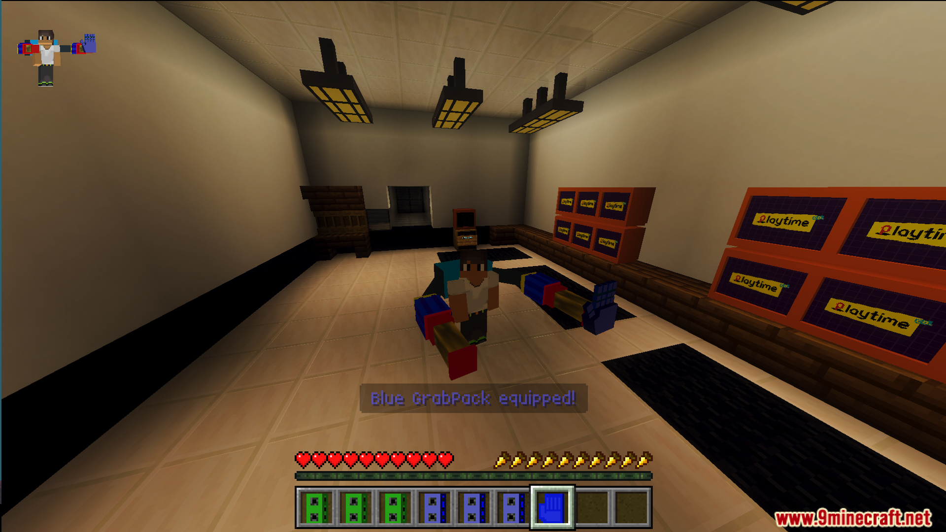 Player character equipping a blue grabpack in the Poppy Play Time map