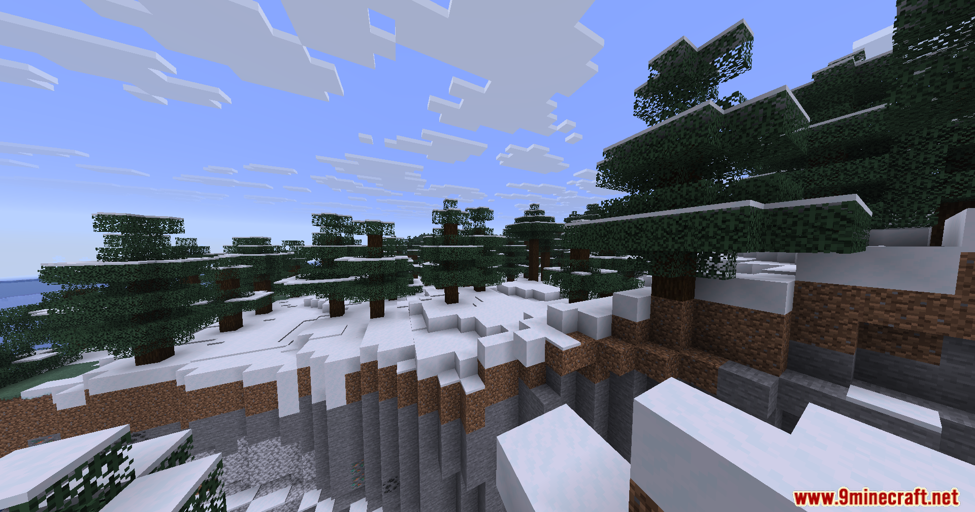 Pv Addon Soundphysics Mod Screenshot 4 Snowy spruce trees on a cliffside overlooking a deep stone ravine in Minecraft
