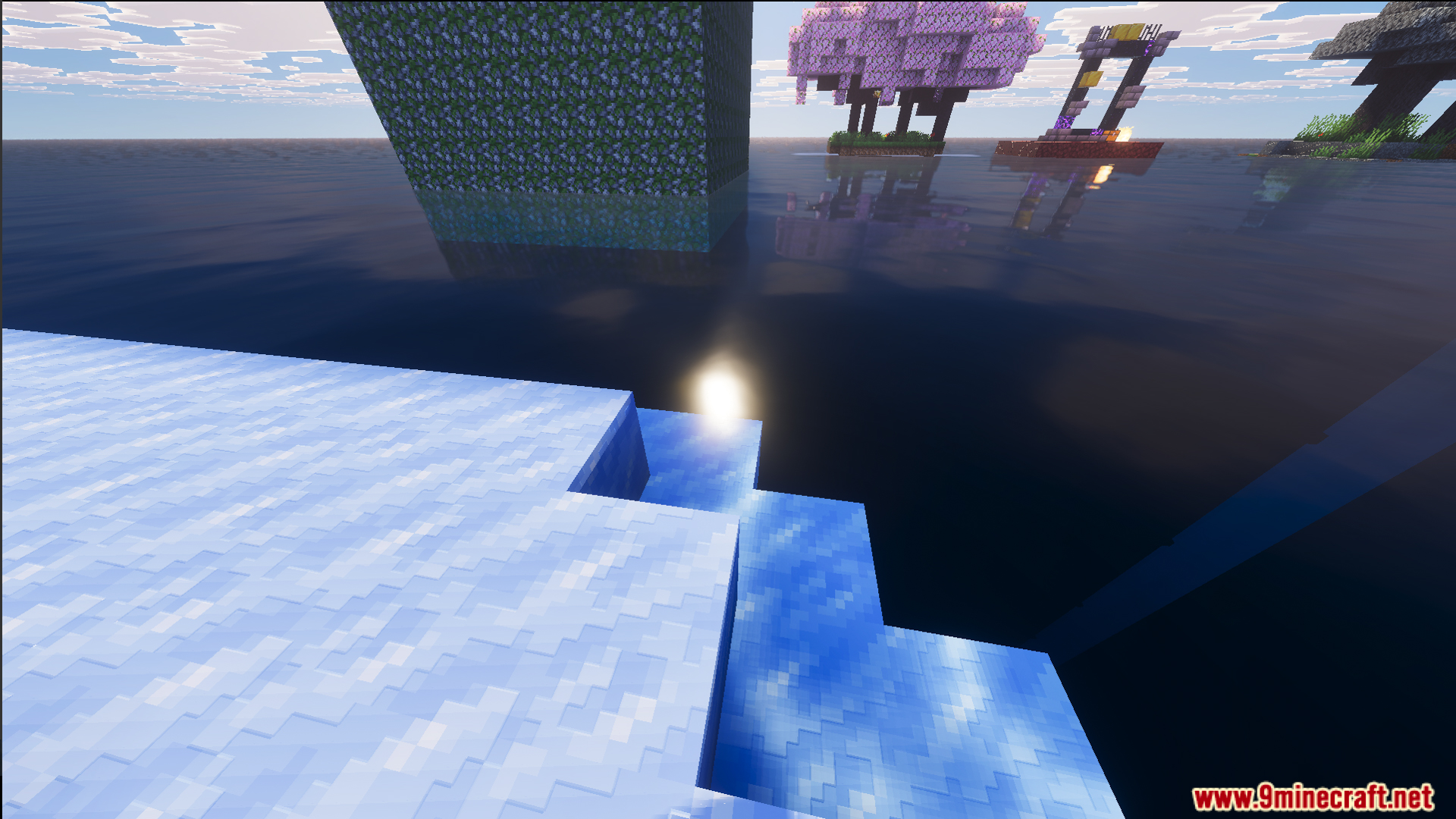 Floating islands with trees and a ruined portal viewed from a snowy platform