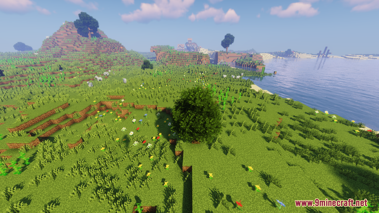 Rainbow's Foliage Resource Pack Screenshot 7 A large bushy tree stands in a green Minecraft field next to a lake