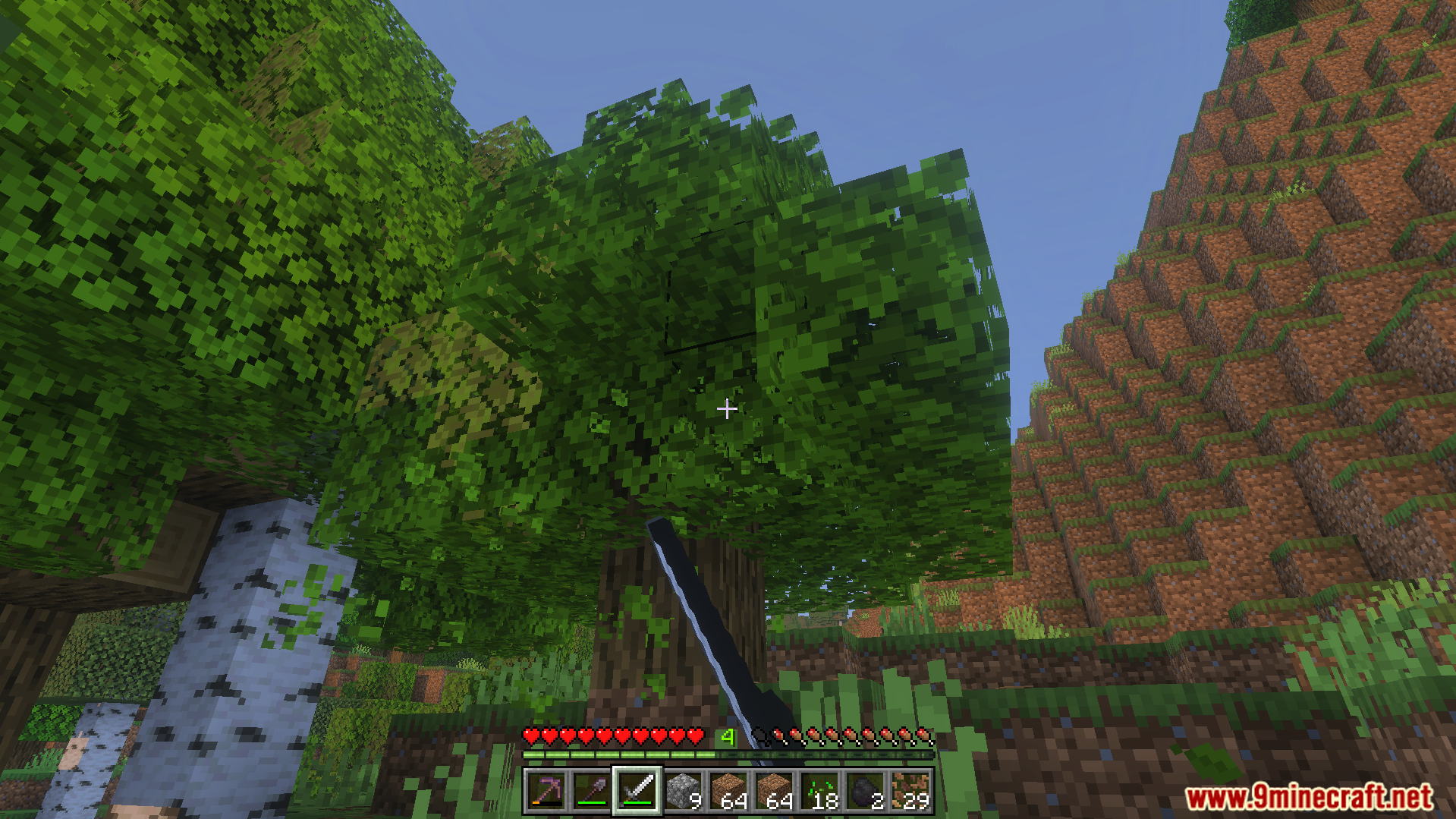 Random Enchantment Addon Screenshot 6 Player exploring a forest biome while holding a sword and gathering building materials