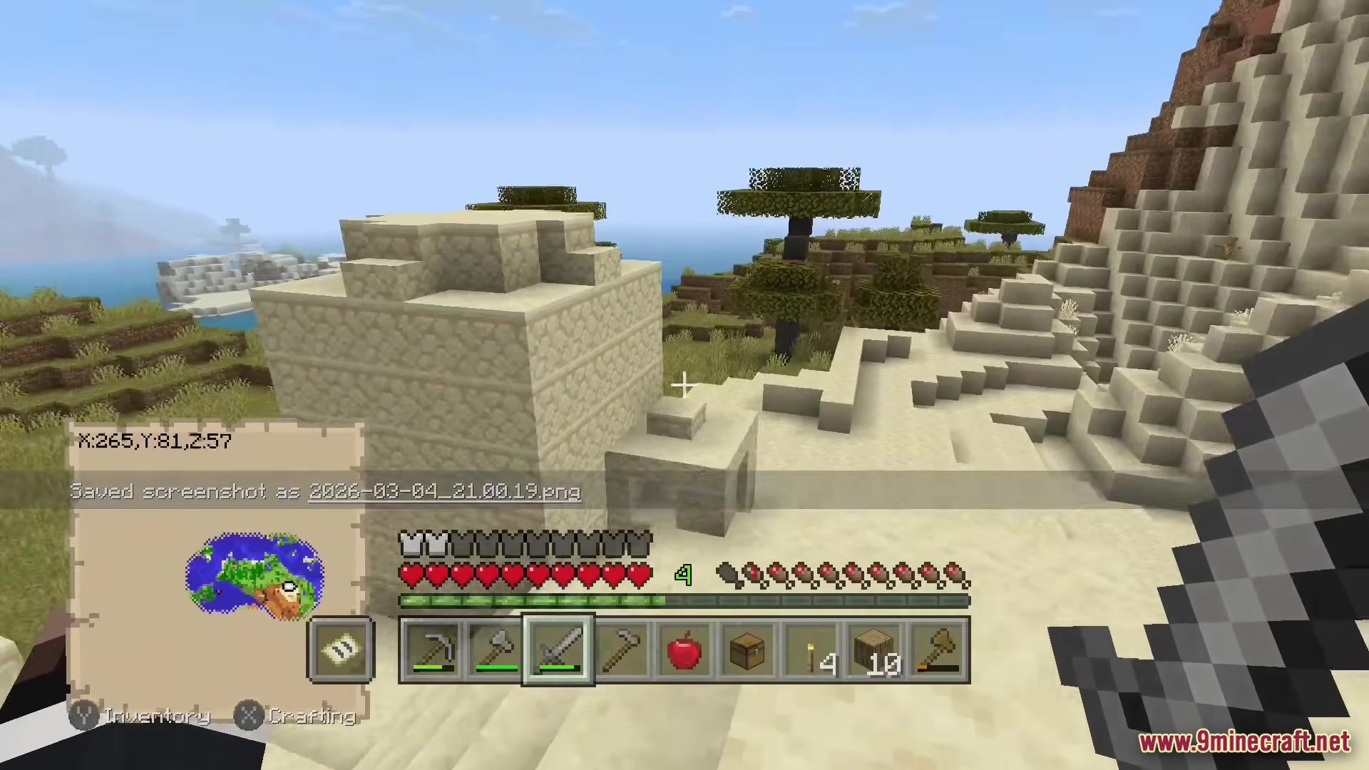 Re-Console Modpack Screenshot 10 Player explores a desert biome while holding a map with Legacy Console UI