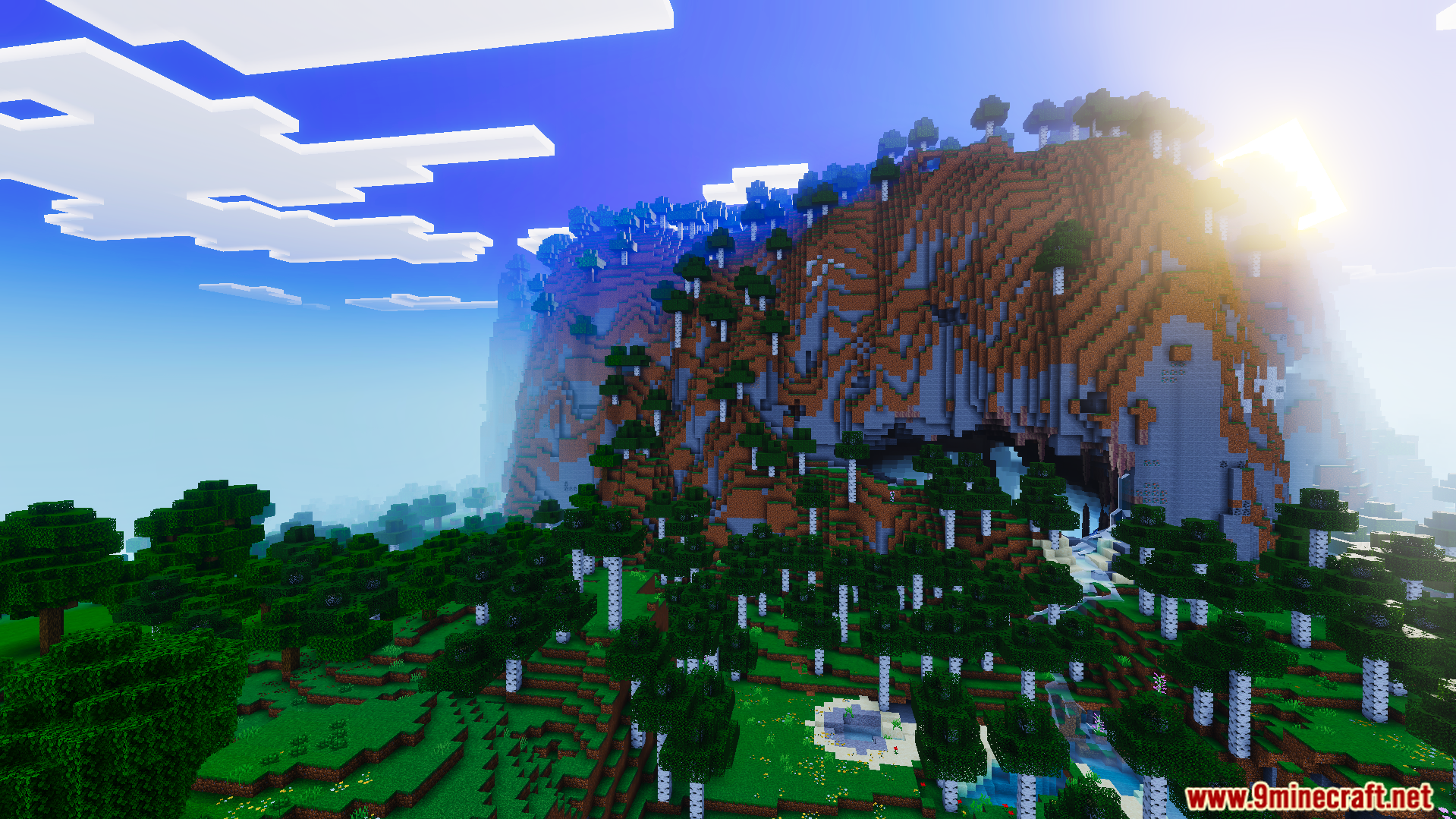Realism Visuals Shader Screenshot 4 Bright orange sunset lighting shines over a large mountain and birch forest