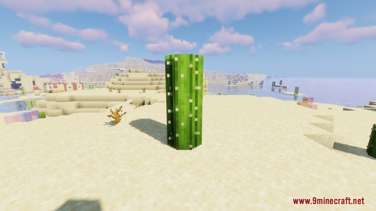 A rounded cactus stands in a desert biome with a village in the background