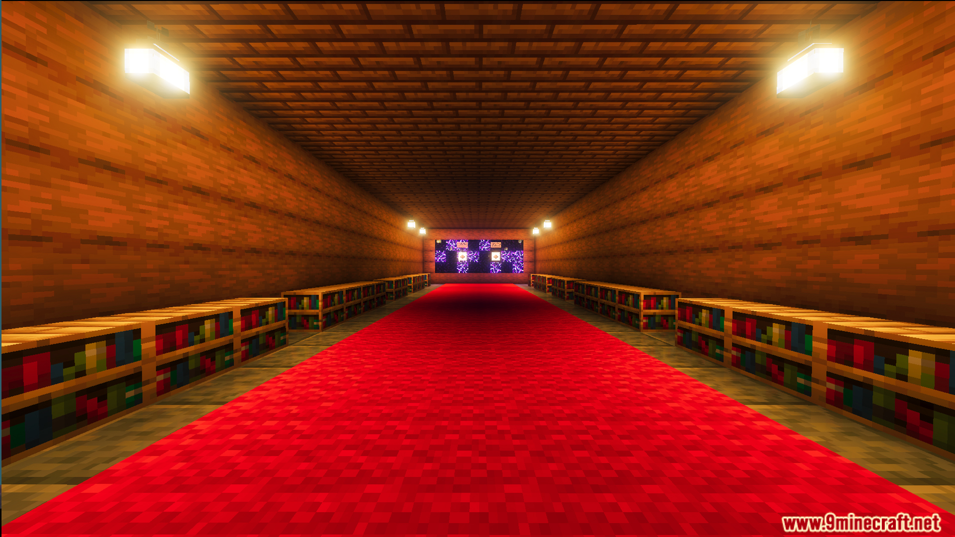 Long corridor featuring a red carpet and wooden bookshelves in a facility