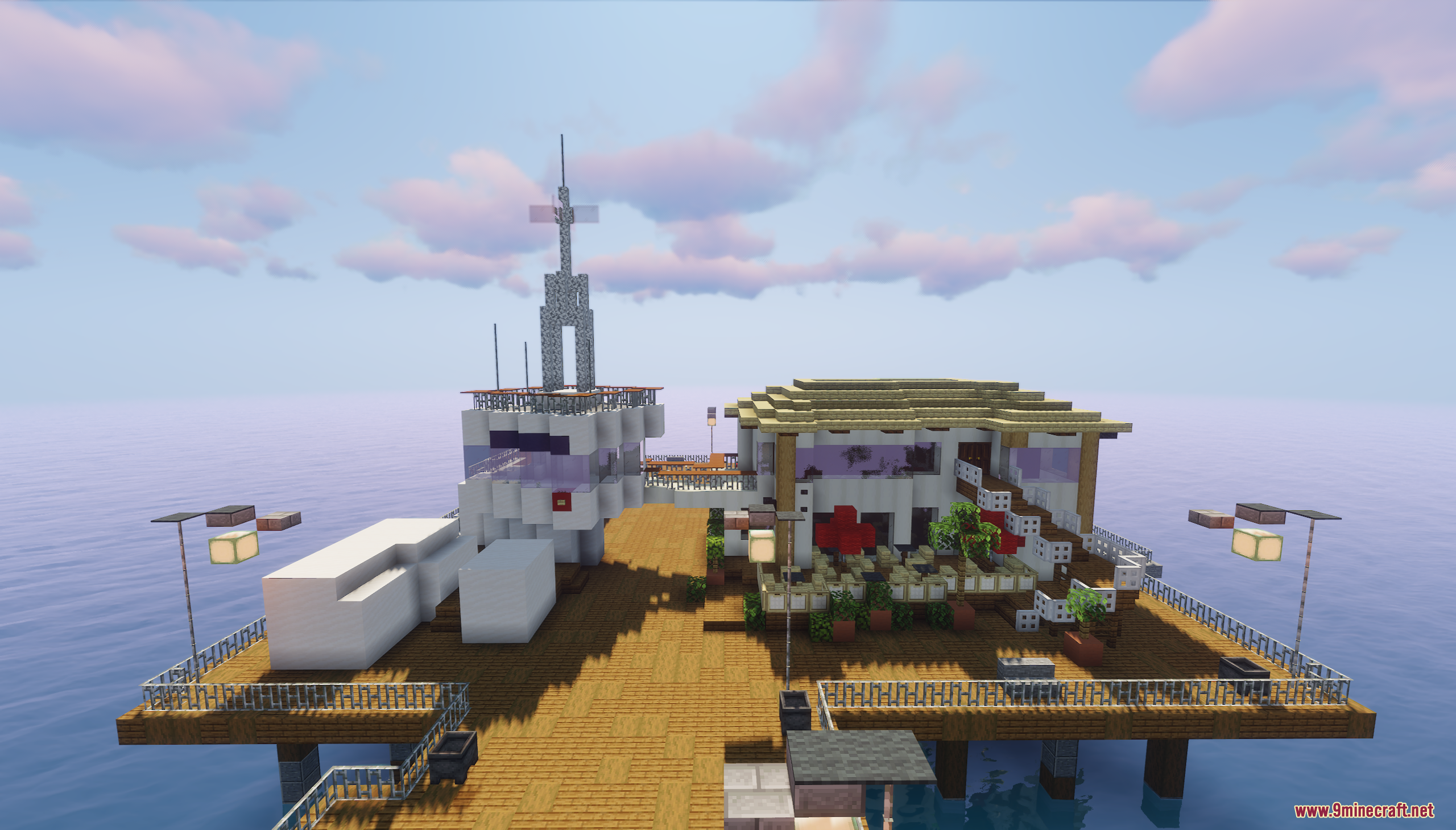 Santa Monica Pier Map Screenshot 10 A white building with a tower and outdoor seating on a wooden pier