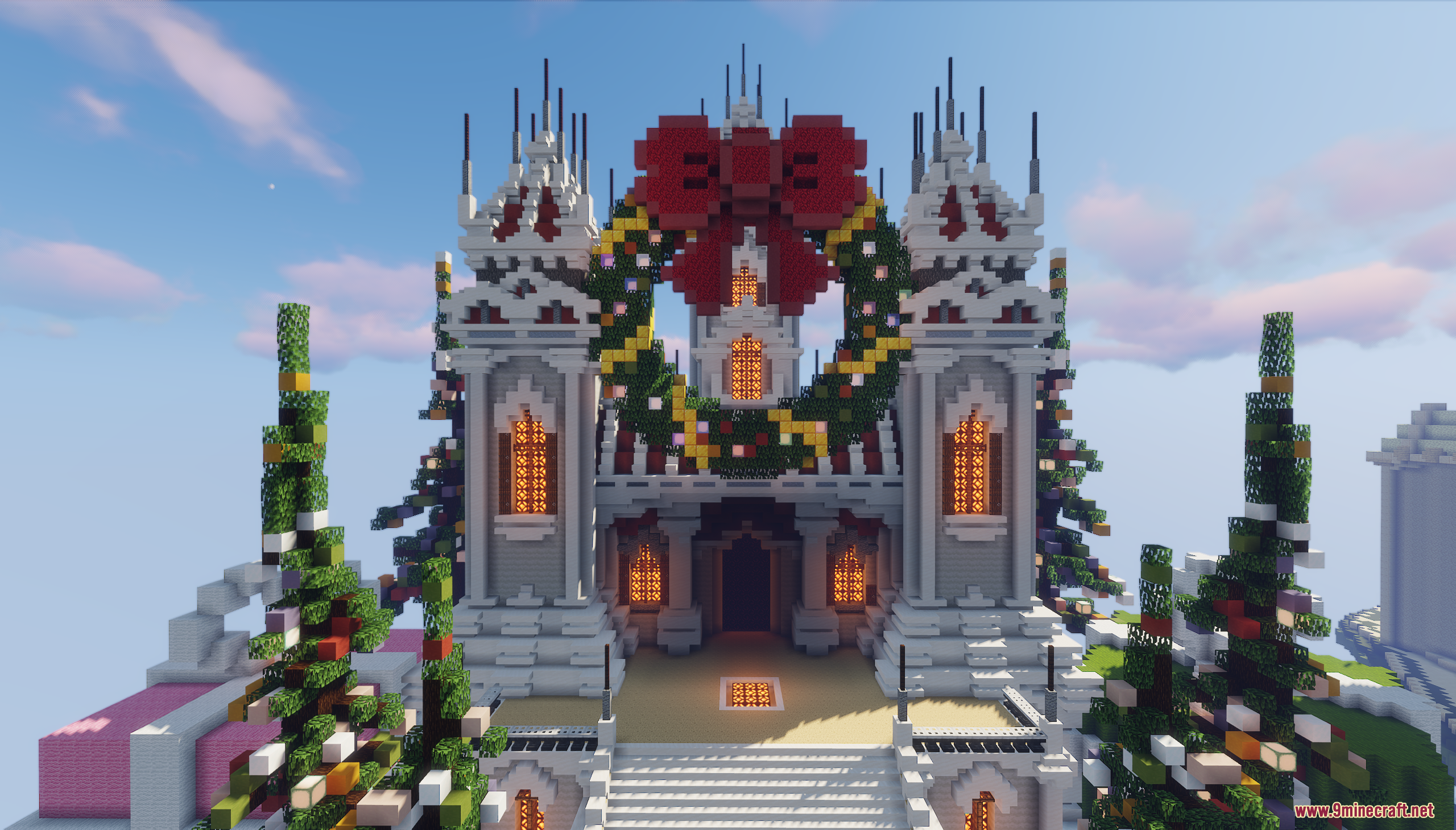 A grand building in Minecraft decorated with a large wreath and red bow