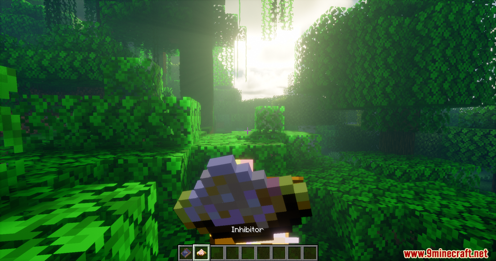 A player holds a magical inhibitor item within a dense jungle biome
