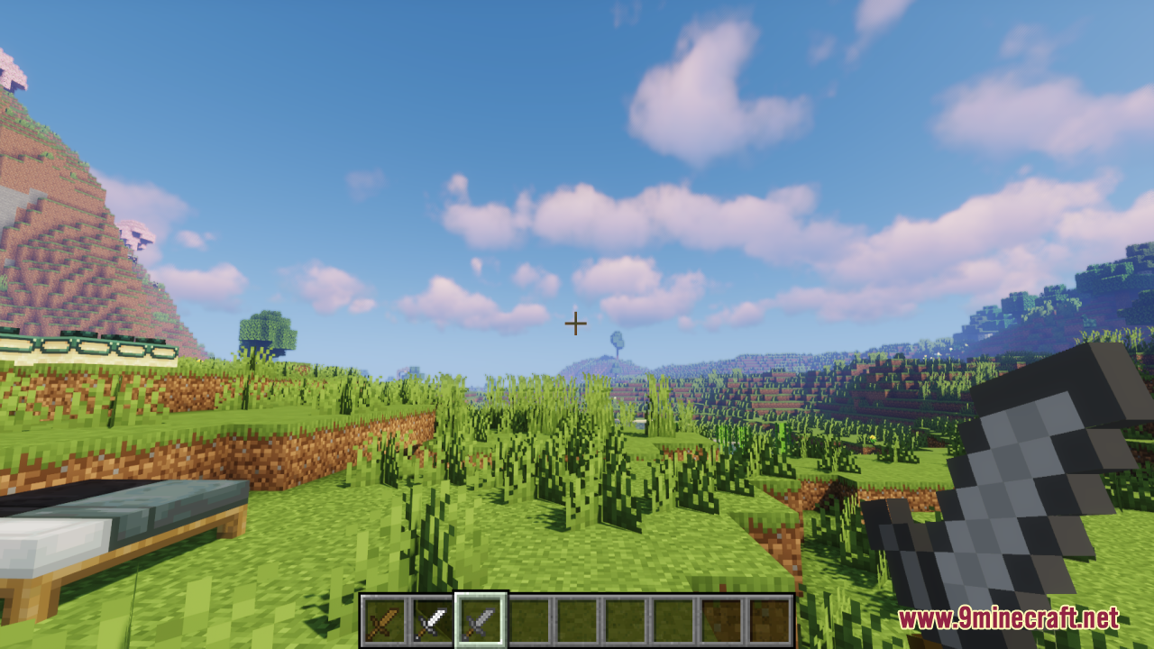 First person view of a player holding a short sword in a field