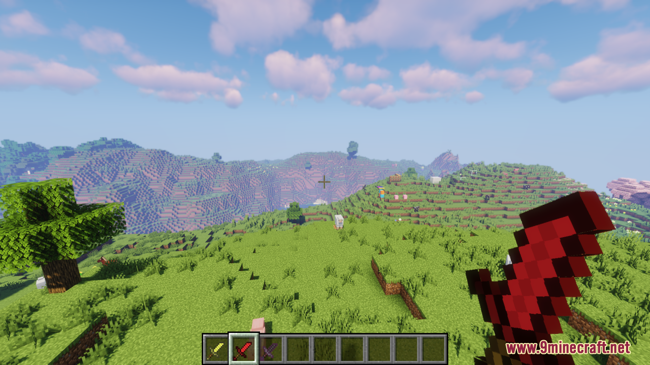 A player holds a short red sword while looking at a vast landscape