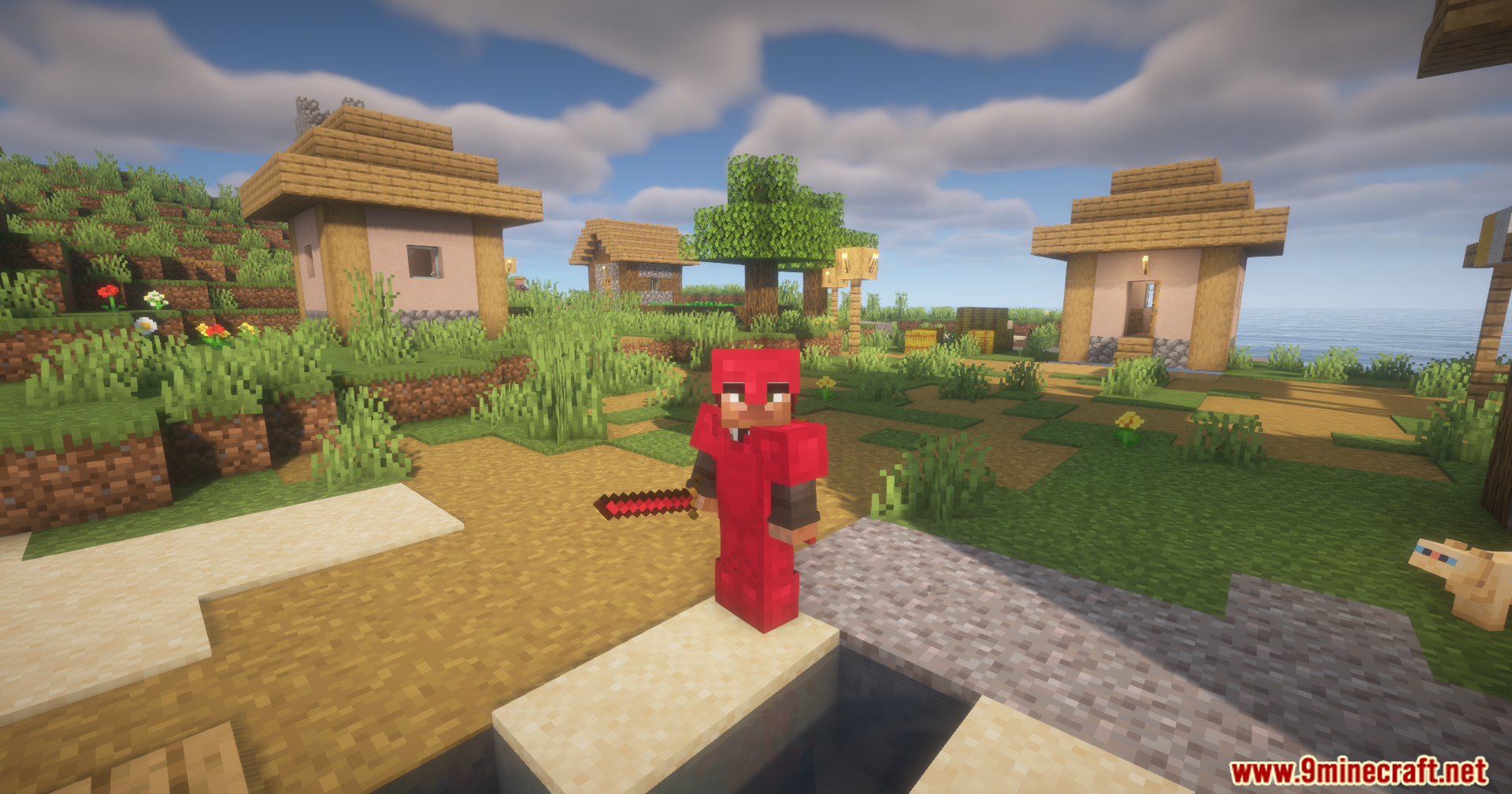 Silent Gear Metalworks Mod Screenshot 9 A player wearing red metal armor and holding a sword in a village