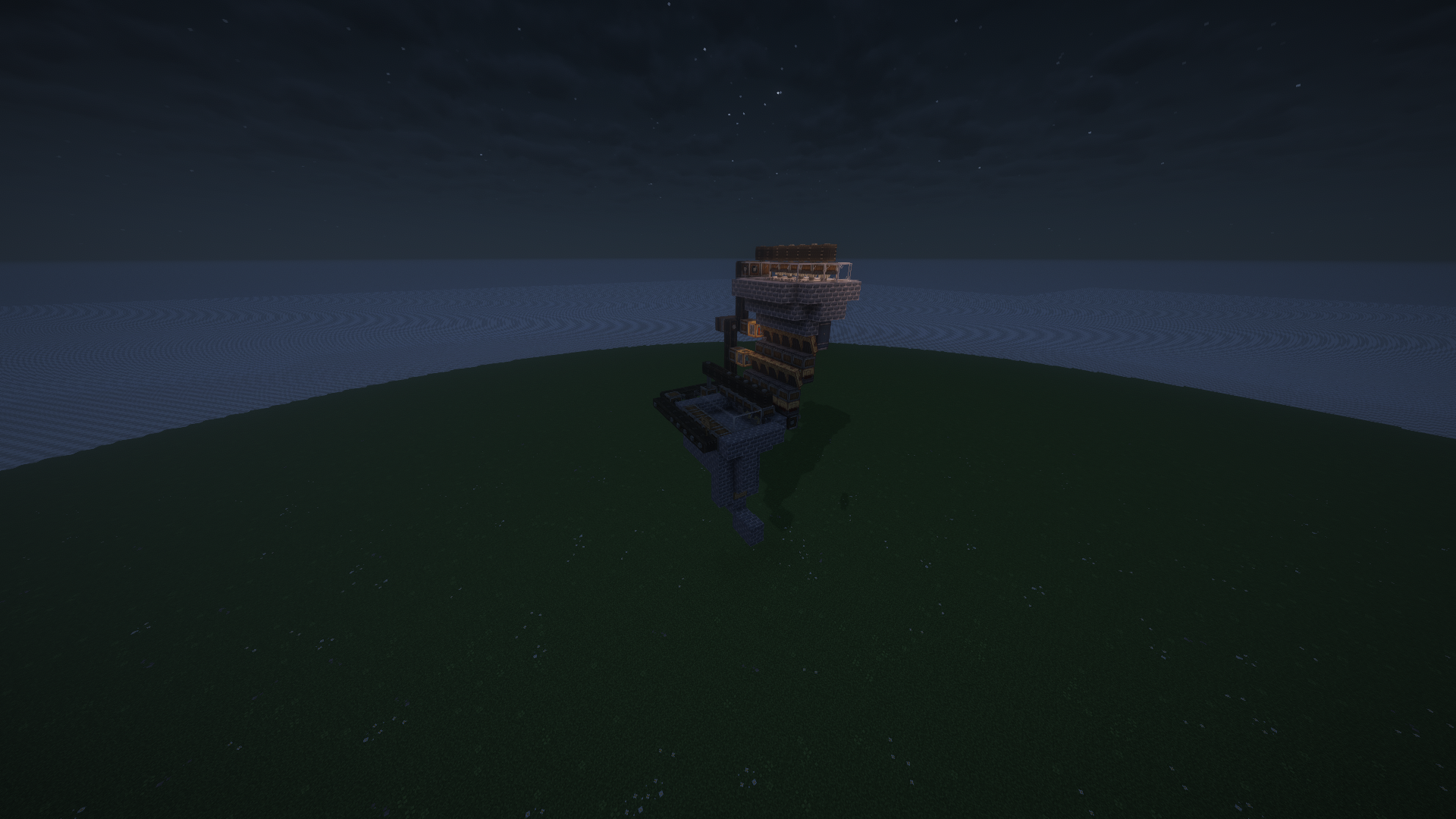 A vertical silverfish XP farm structure built on a flat grass field at night