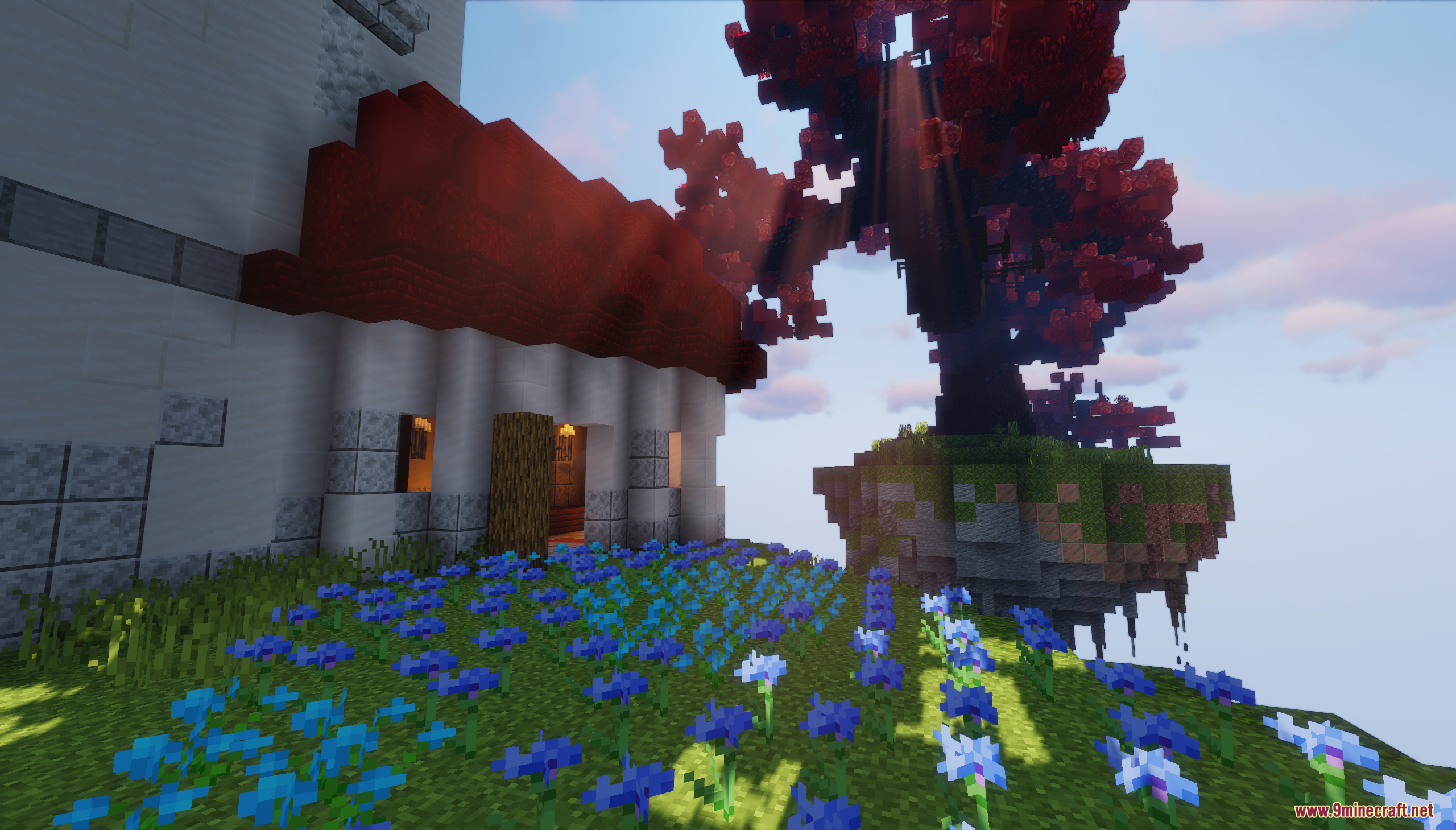 Blue flowers blooming near a white castle on a floating island