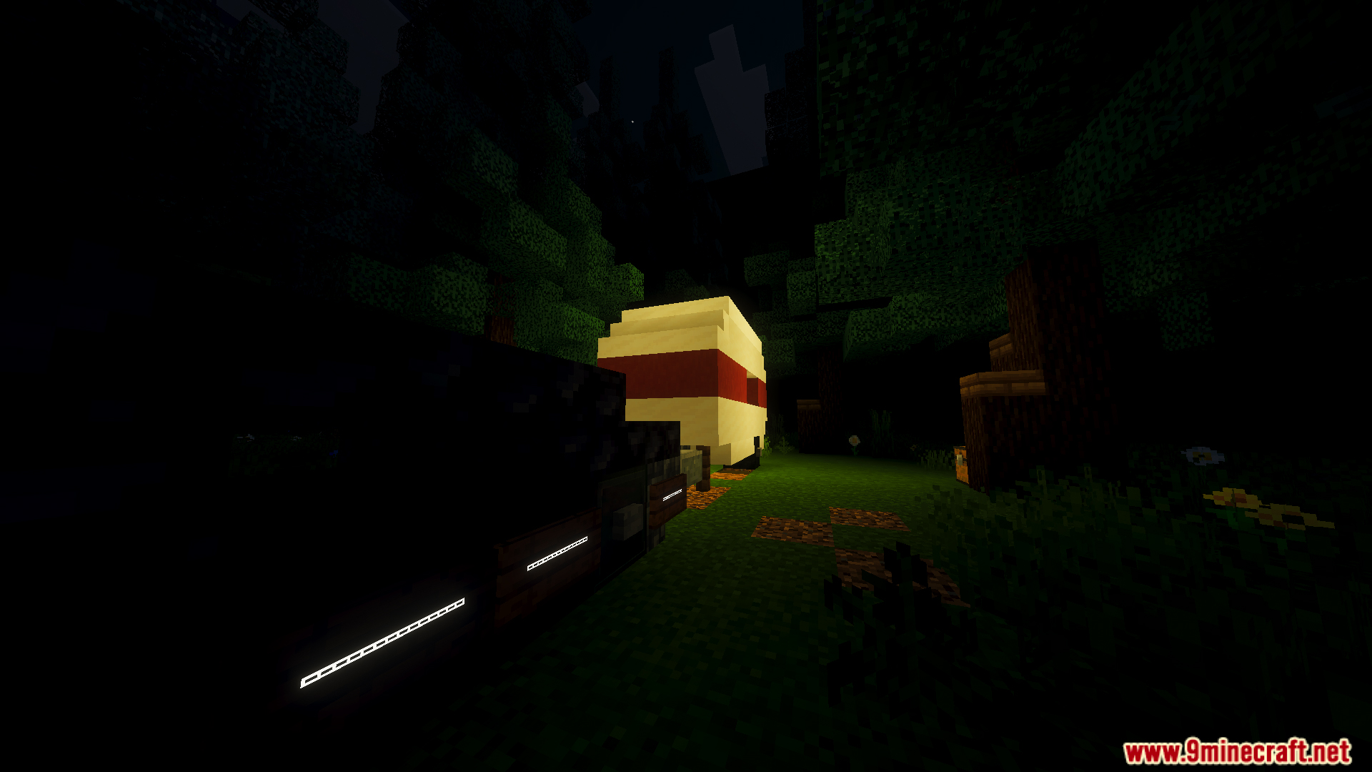 A dark forest campsite in the Slenderman Online Map at night
