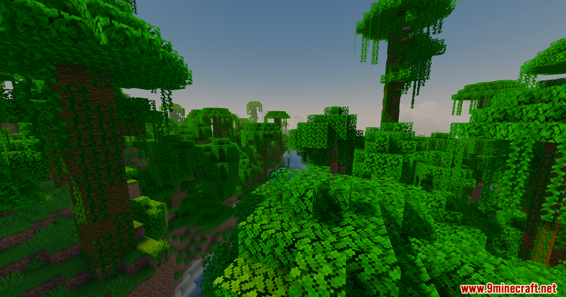 Slight Shaders Screenshot 8 Sunlight filters through the dense leaves of a vibrant green Minecraft jungle biome