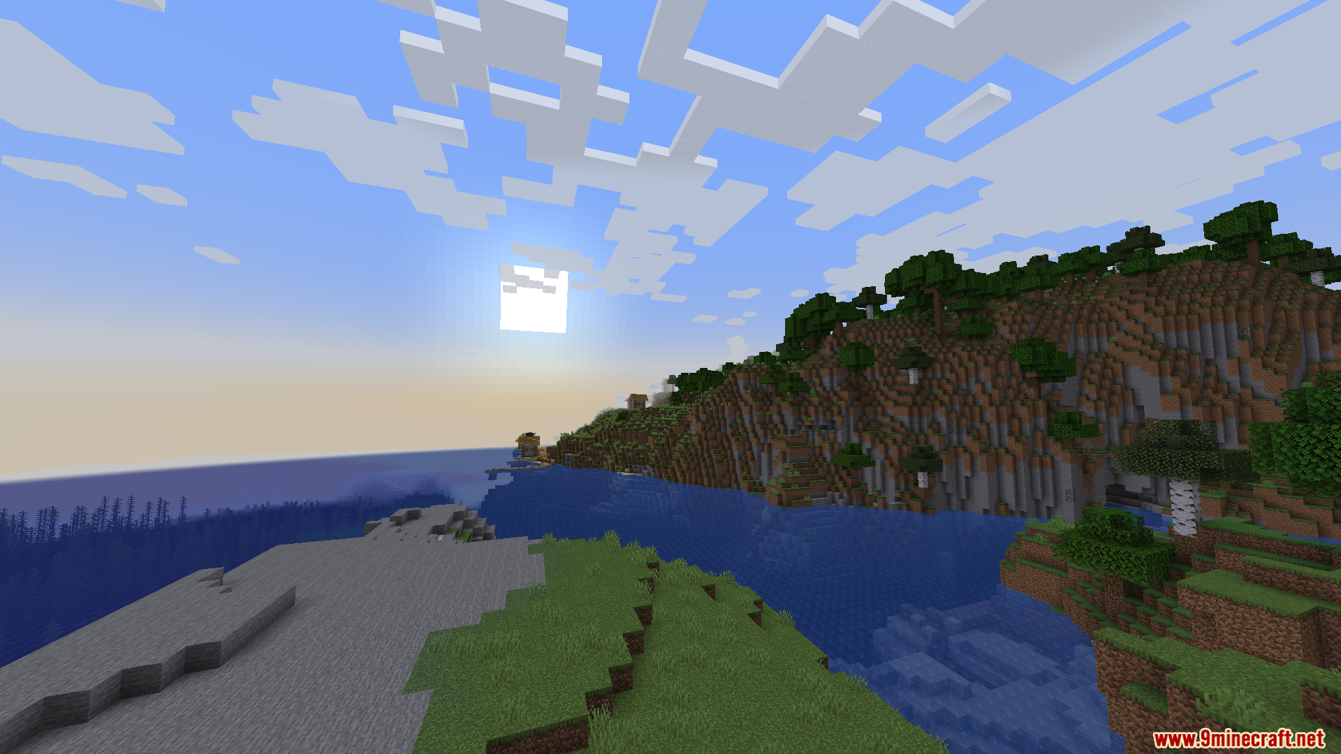 Smooth Boot Reloaded Mod Screenshot 3 Scenic view of a Minecraft coastline with green hills under a bright sun
