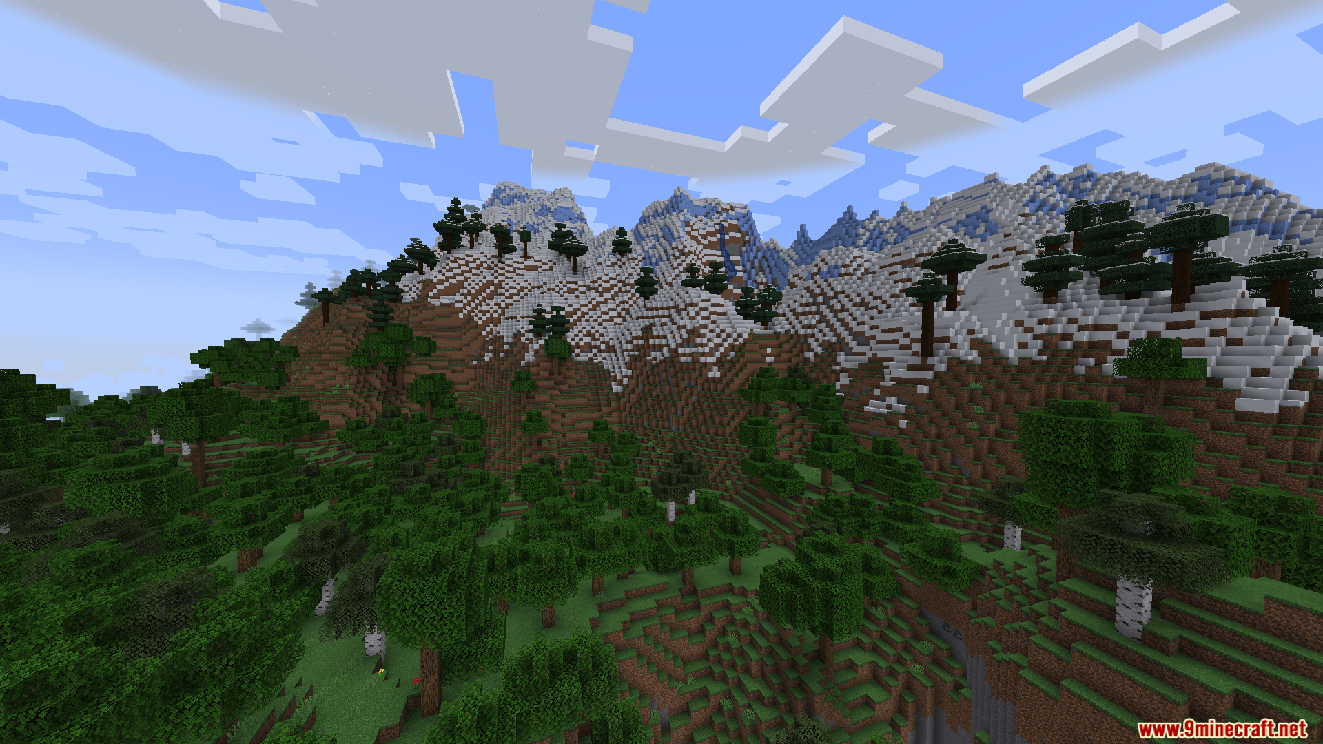 Smooth Boot Reloaded Mod Screenshot 4 Tall snow covered mountains rising above a dense green forest in Minecraft
