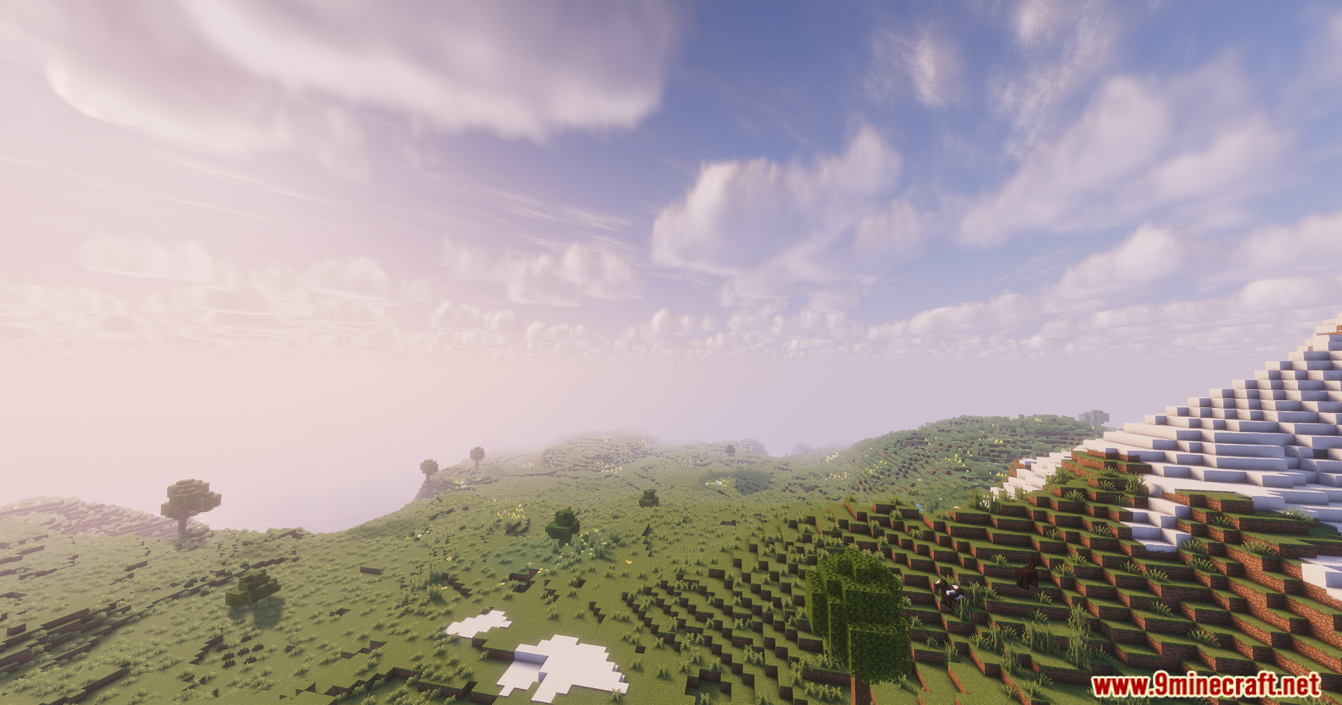 Solar Shaders Screenshot 4 Soft sunlight illuminates a rolling grassy hill with scattered patches of snow