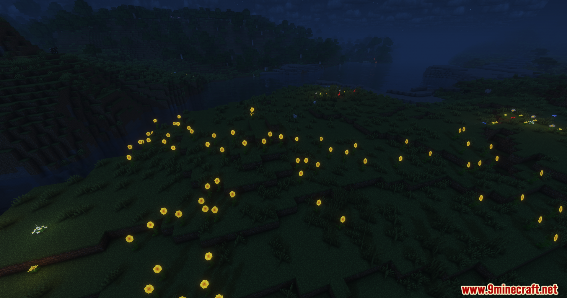 Solar Shaders Screenshot 8 Numerous glowing yellow flowers spread across a dark grassy field during the night