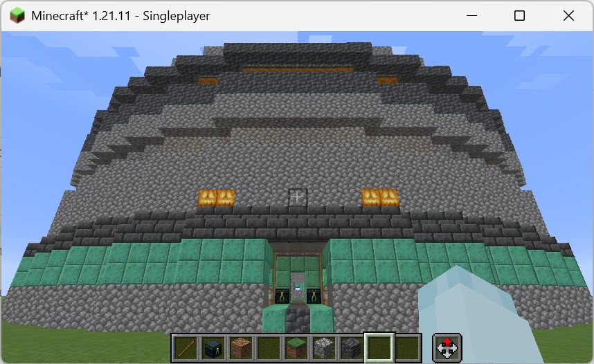 South Town Arena Schematic Screenshots 1 Exterior view of South Town Arena Schematic built with cobblestone and copper blocks