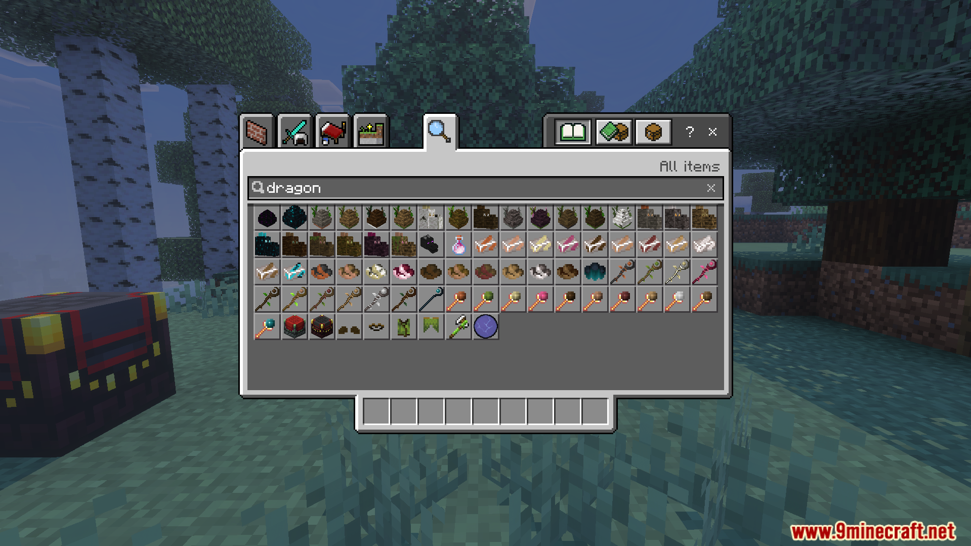 Creative inventory displaying dragon eggs and magic staffs from Spellbound Skies Addon