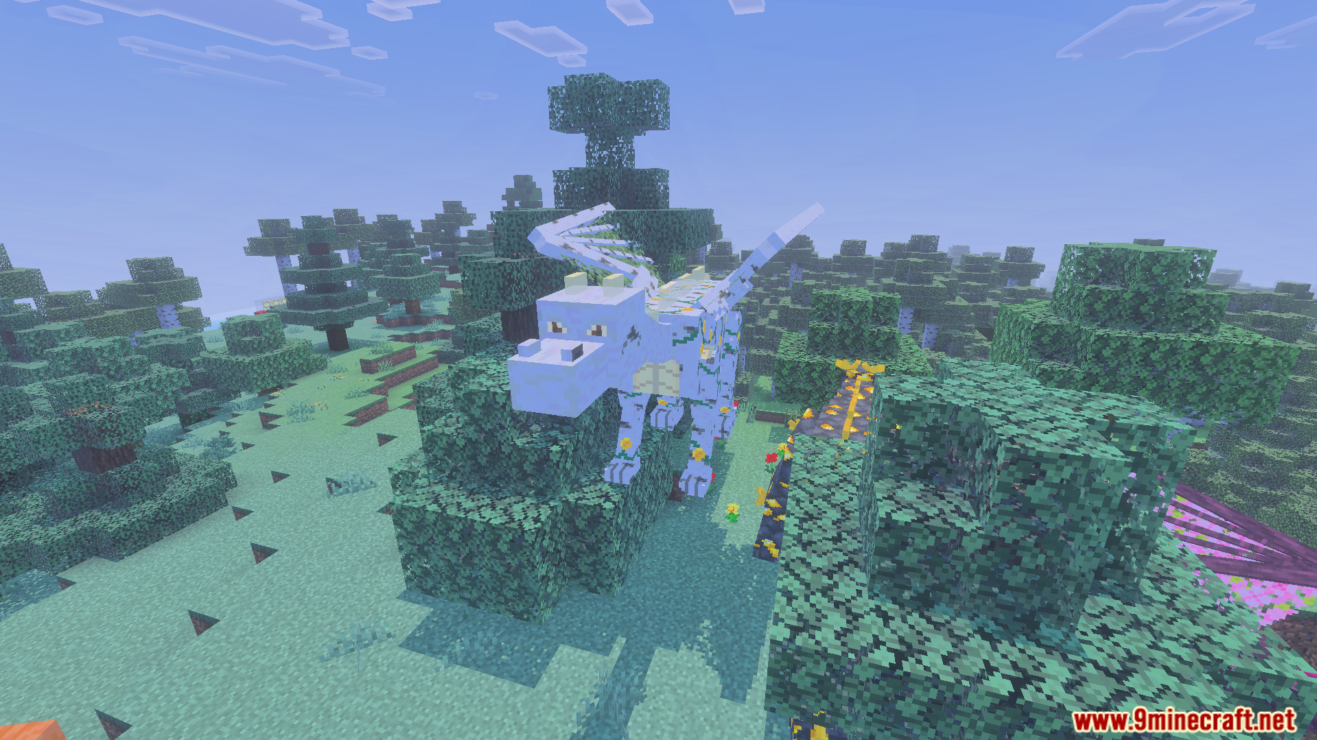 A large white dragon standing on top of green trees in a forest