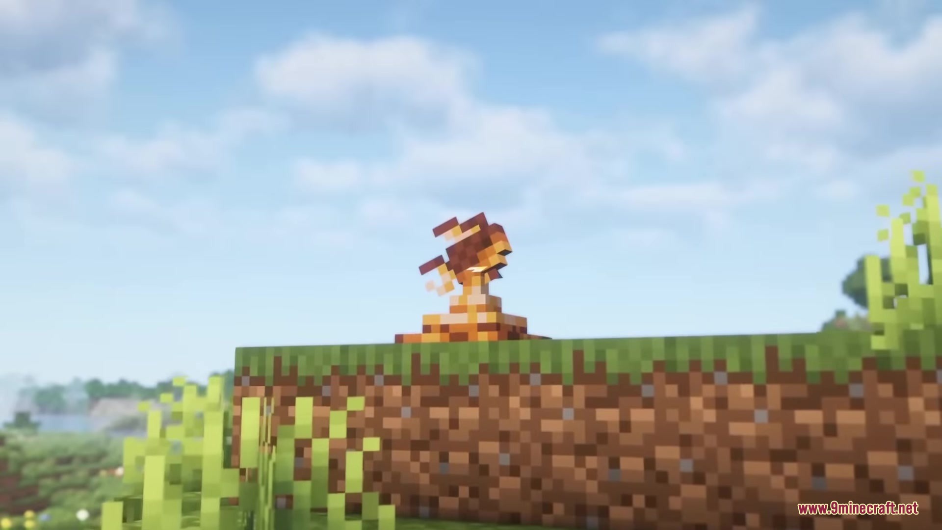 Starcatcher Mod Screenshot 8 A small orange fish model sitting on a grass block in Minecraft